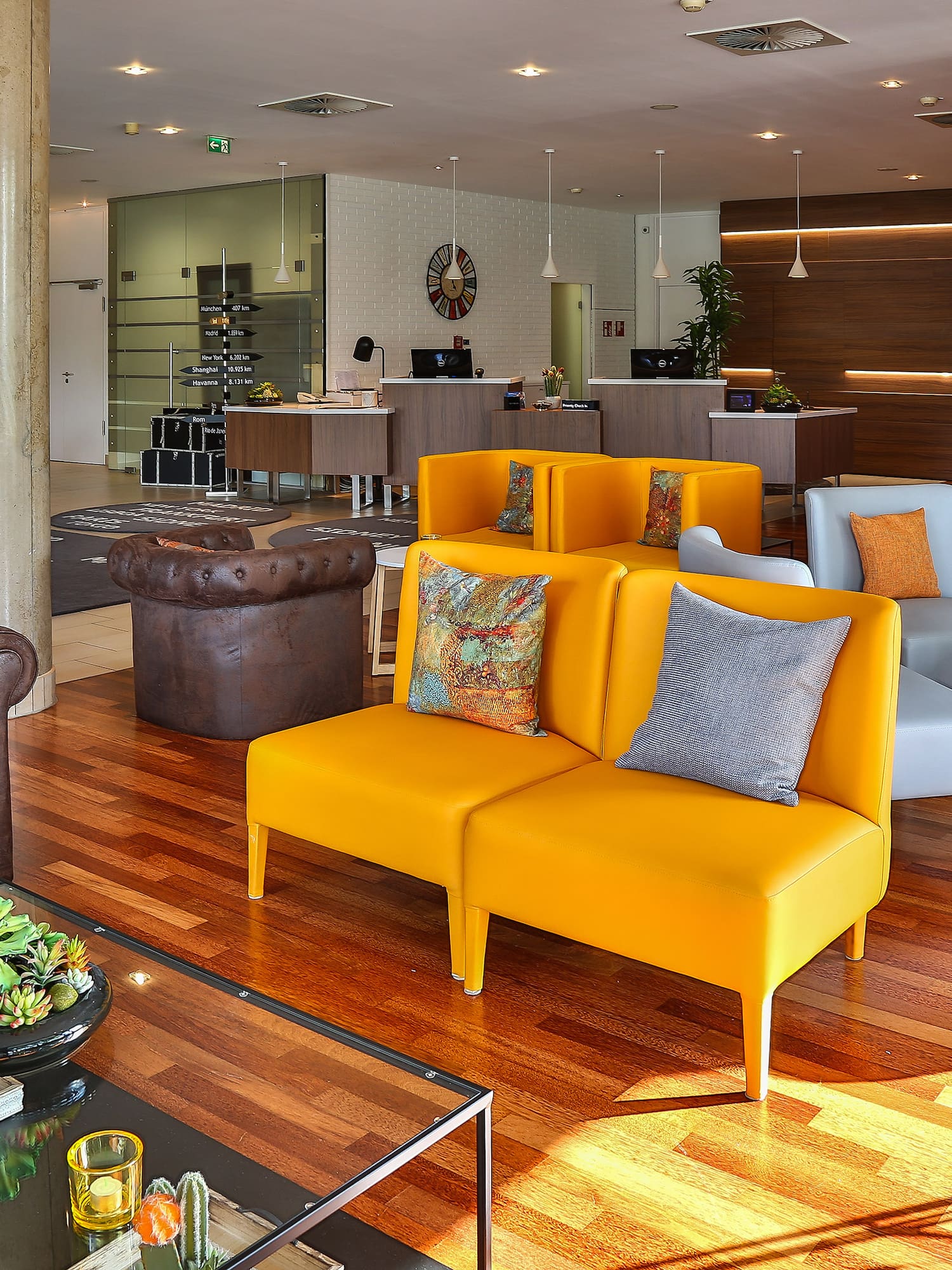 a room with couches and tables