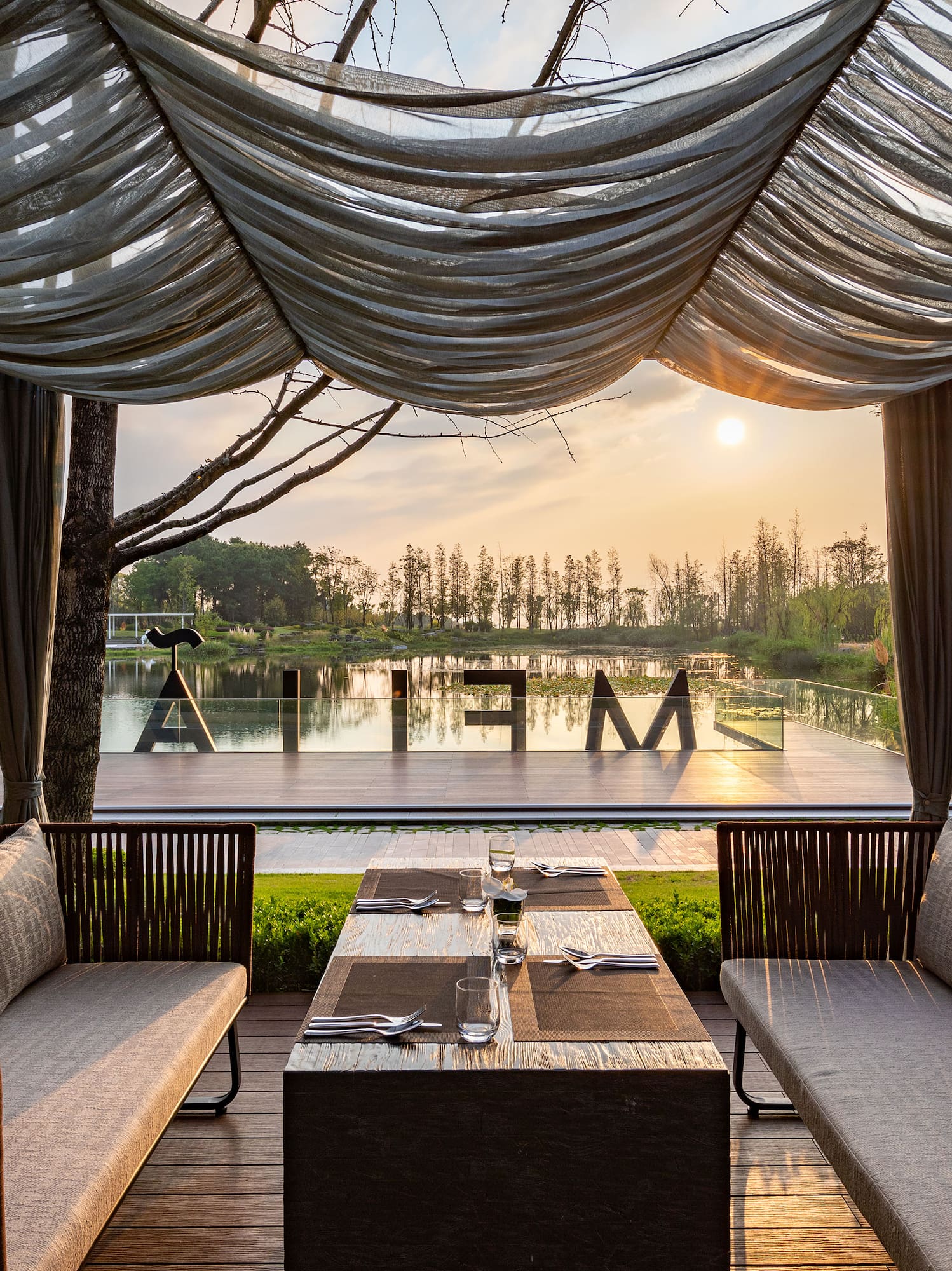 a table and chairs under a canopy