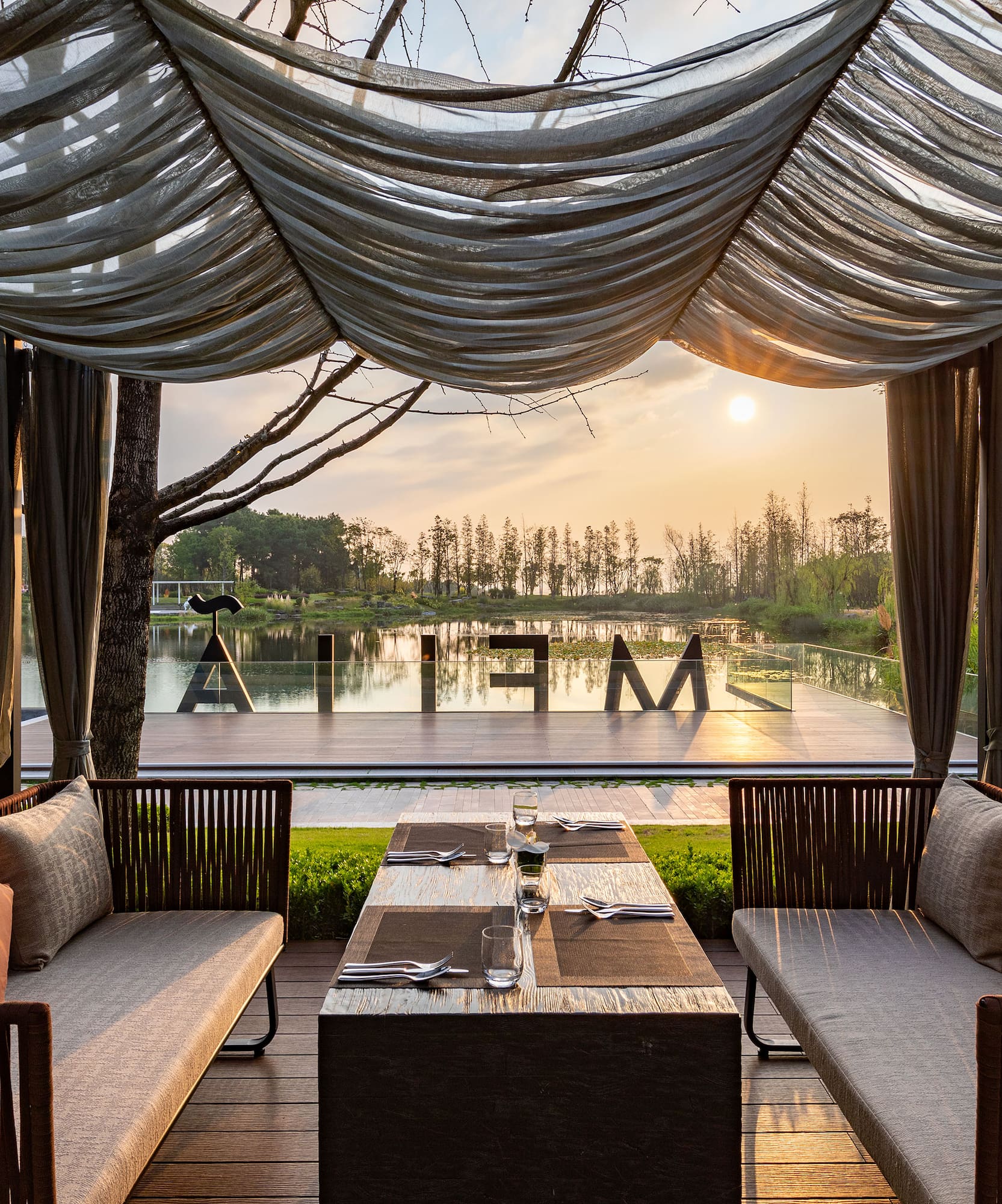 a table and chairs under a canopy
