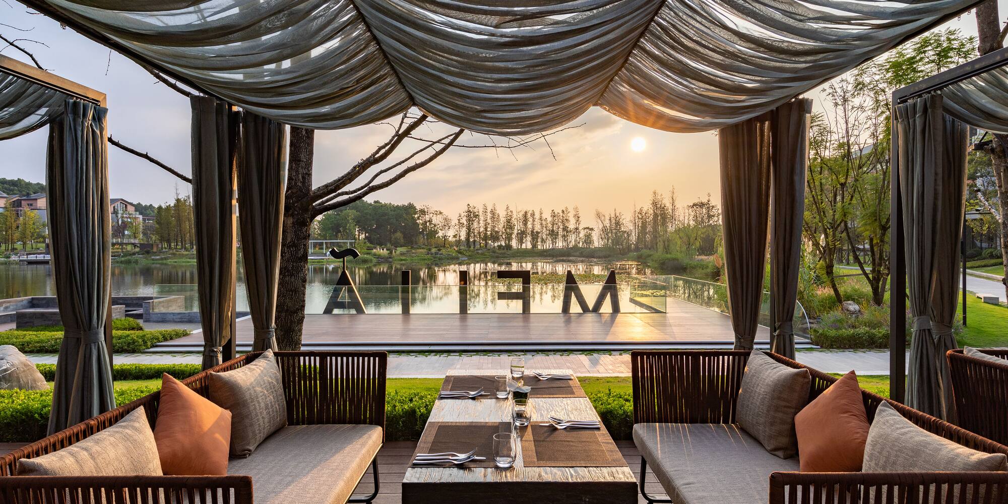 a table and chairs under a canopy