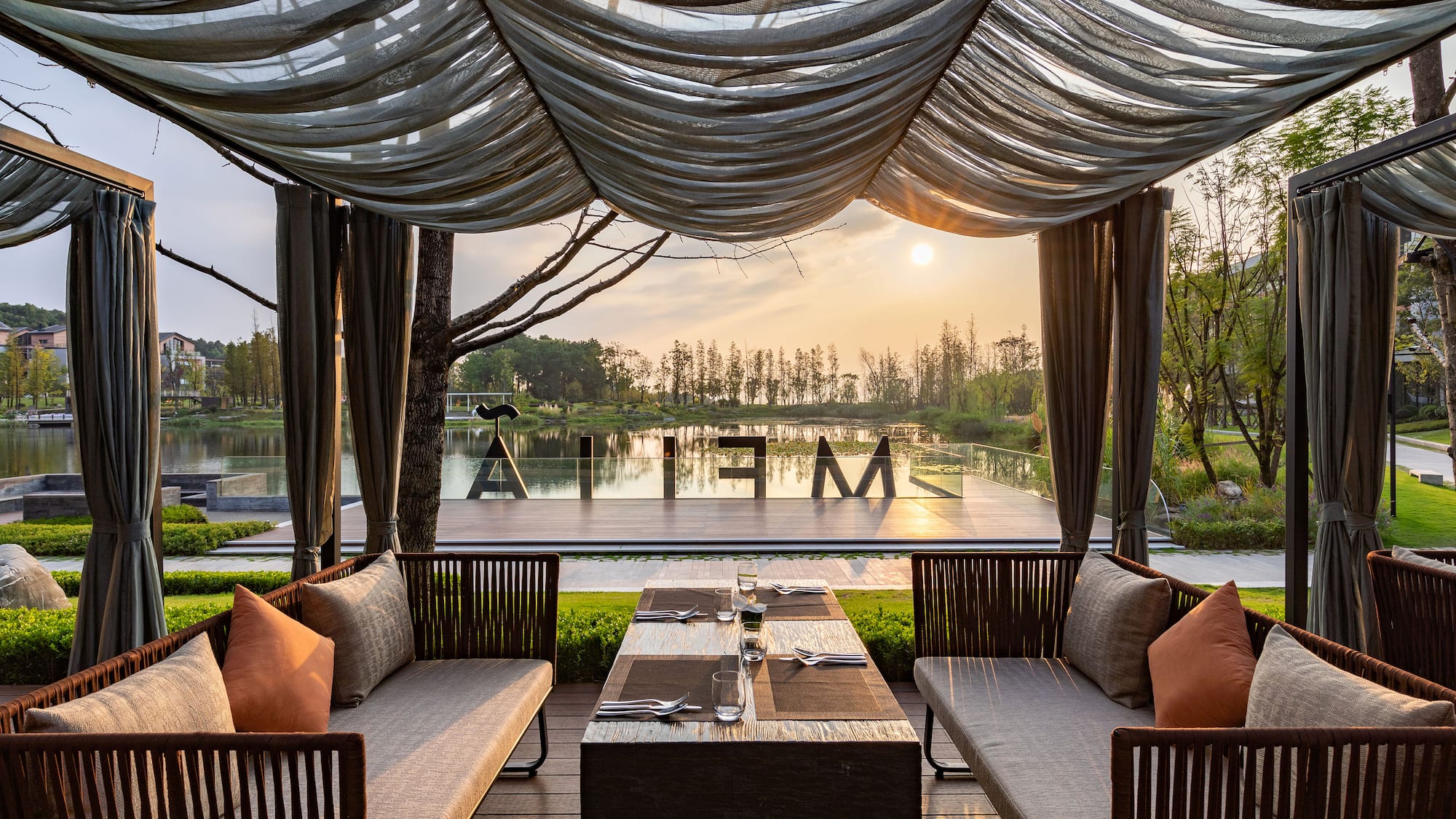 a table and chairs under a canopy