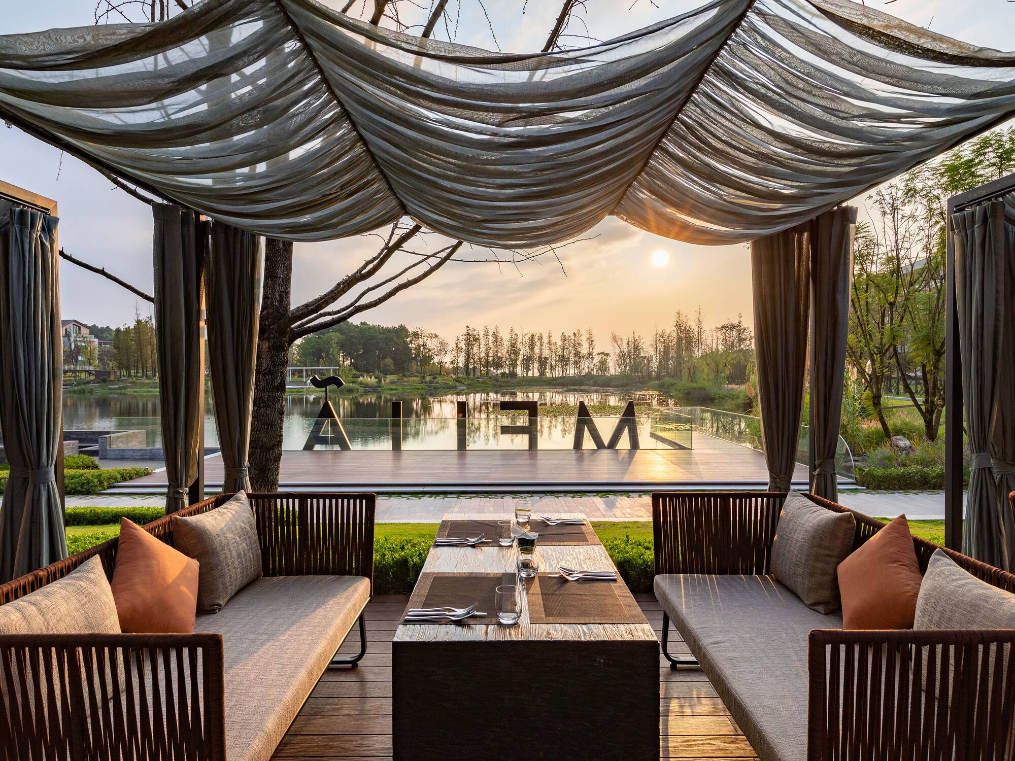 a table and chairs under a canopy