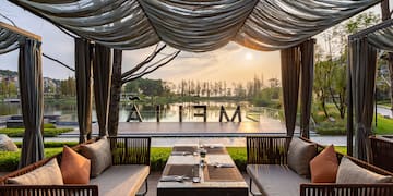 a table and chairs under a canopy