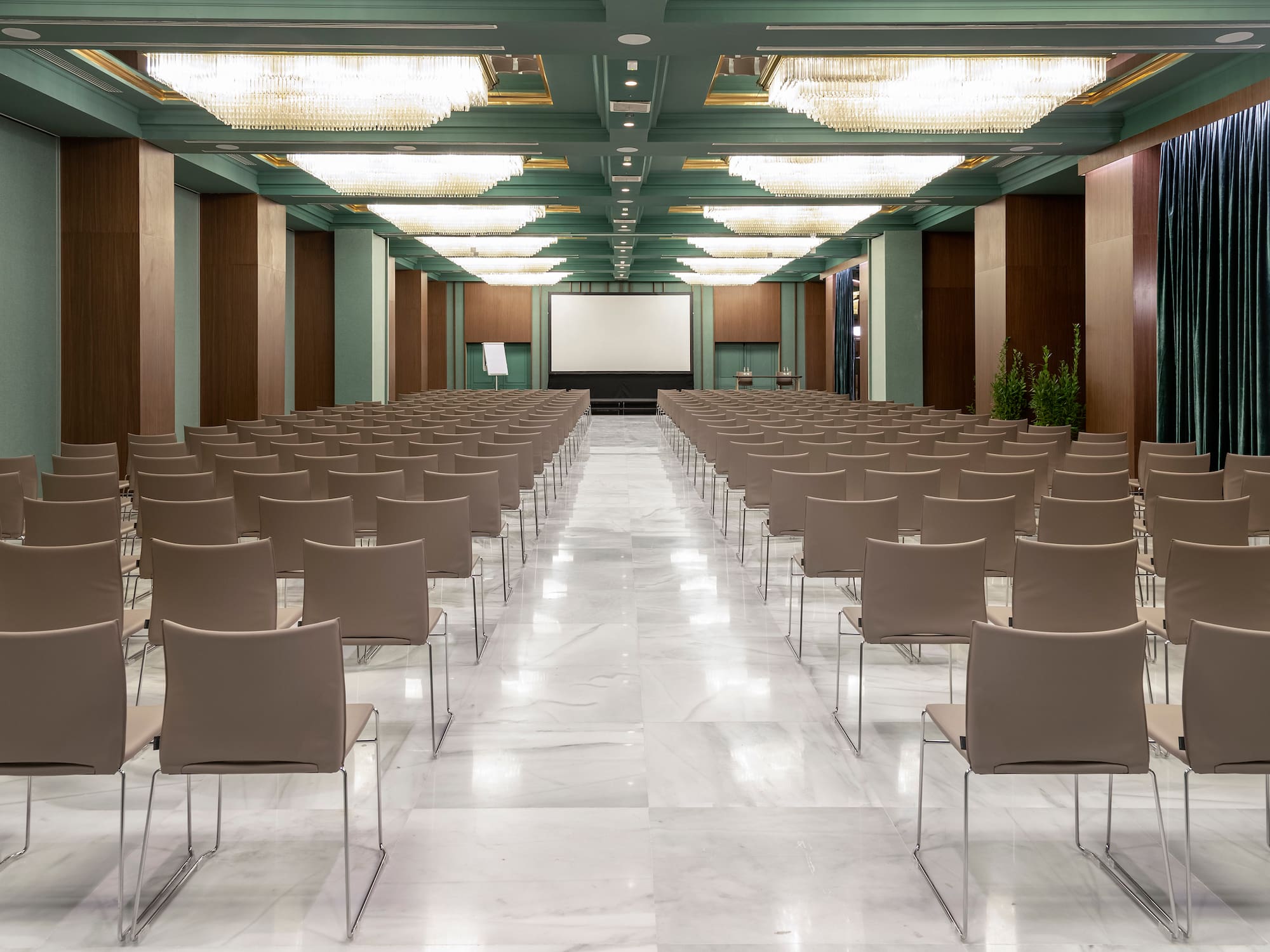 a room with chairs and a projector screen
