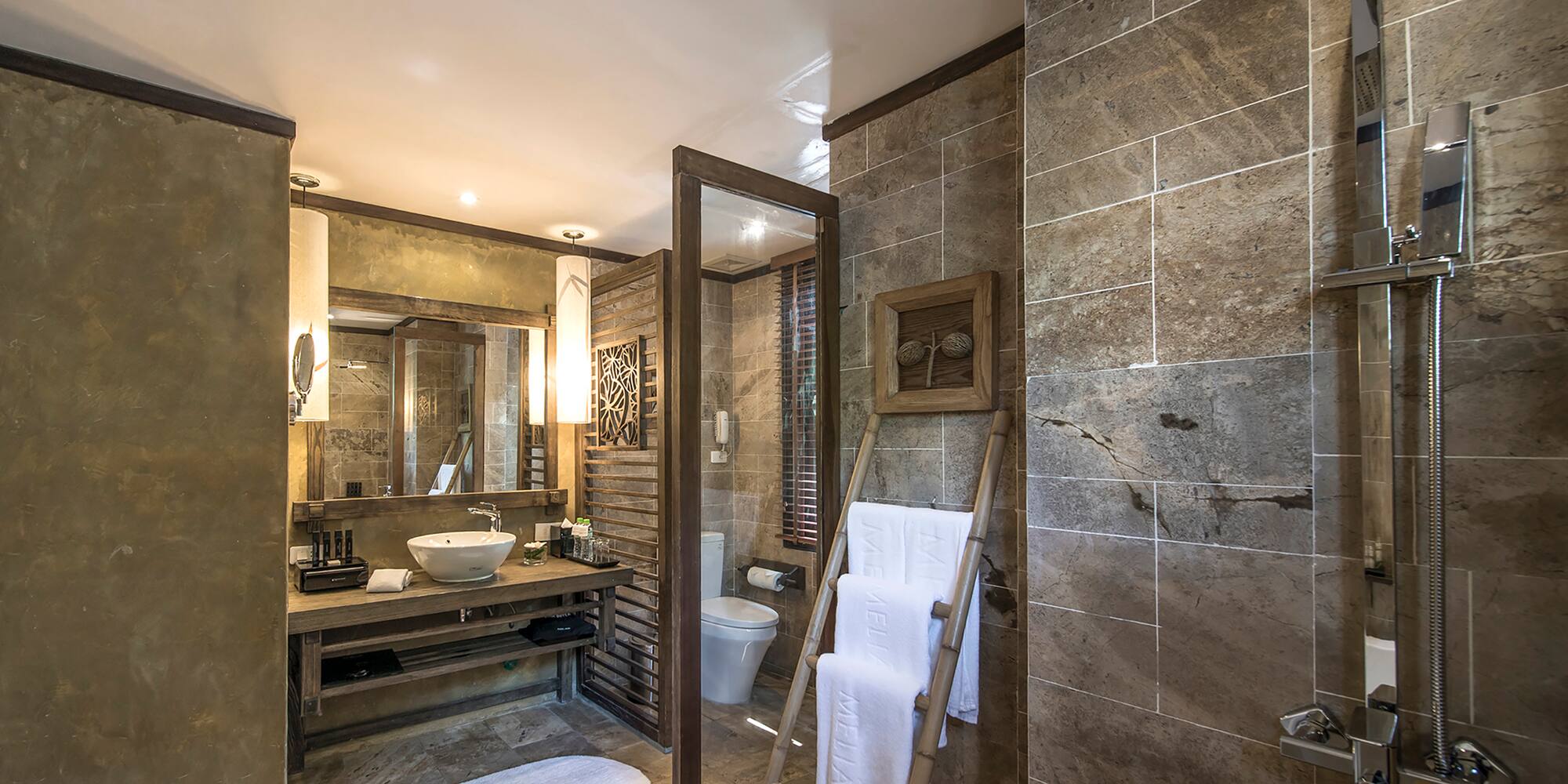 a bathroom with a mirror and a sink