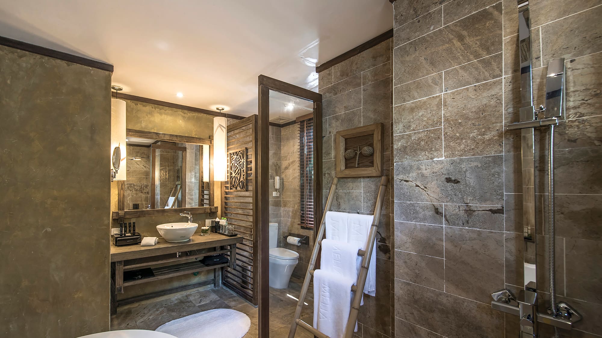 a bathroom with a mirror and a sink