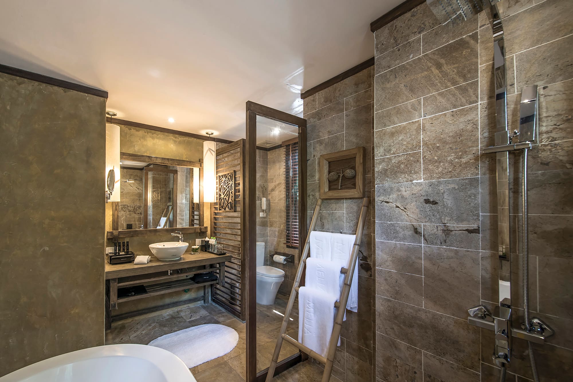 a bathroom with a mirror and a sink