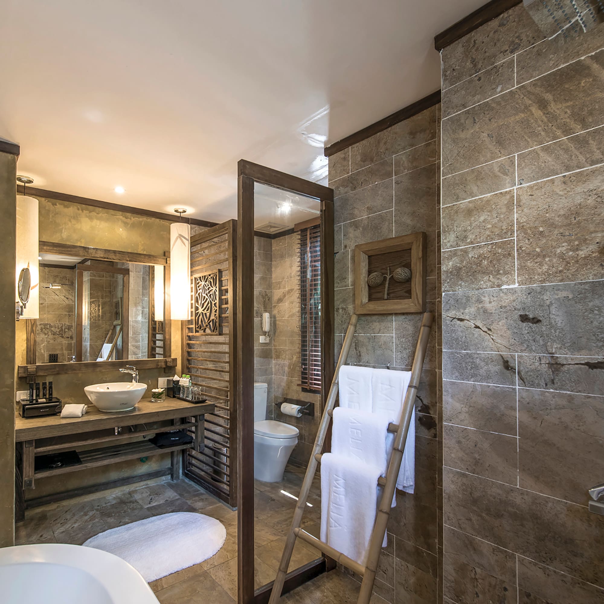 a bathroom with a mirror and a sink