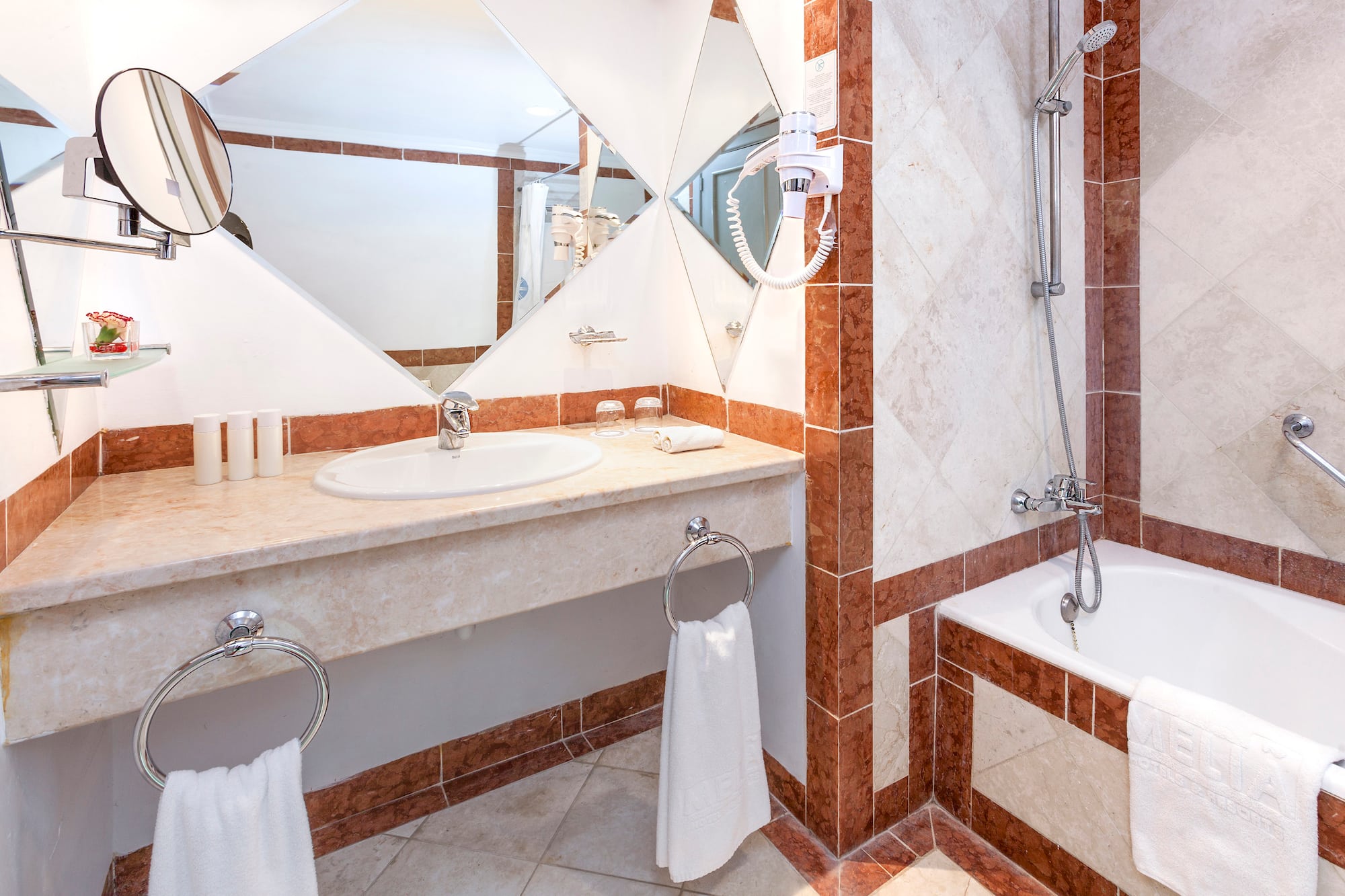 a bathroom with a mirror and sink