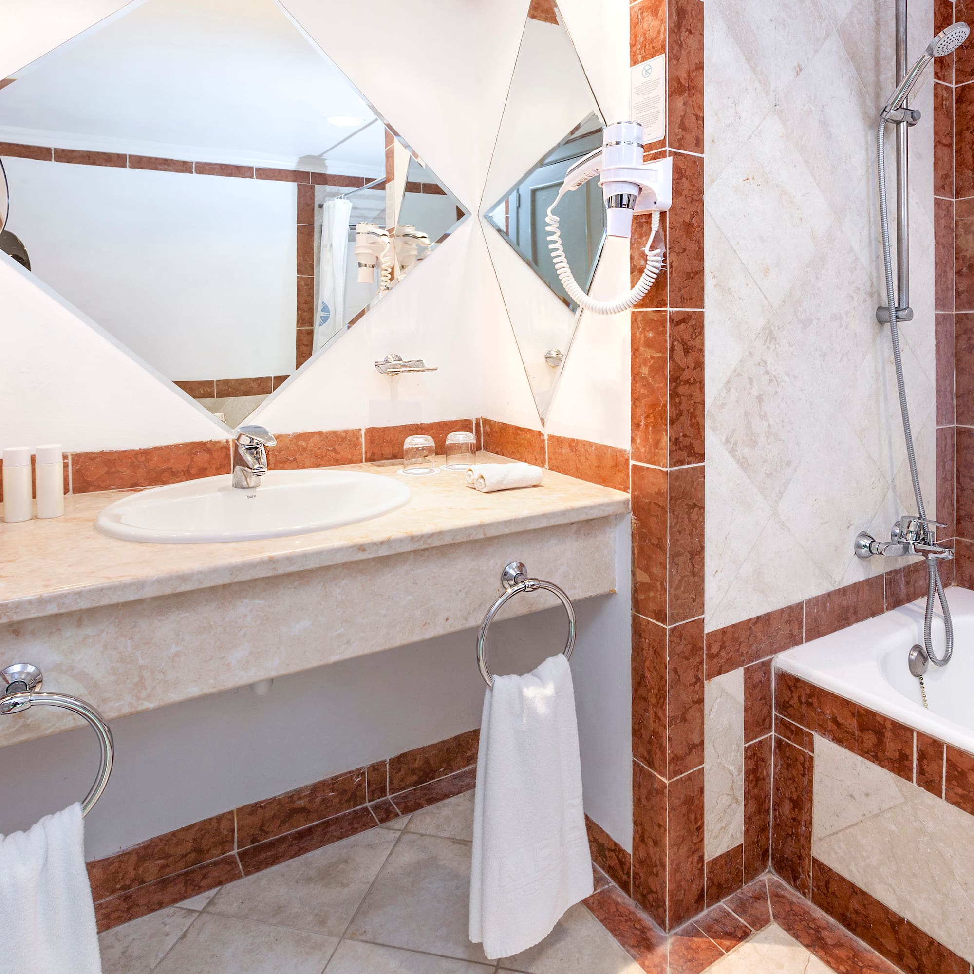 a bathroom with a mirror and sink