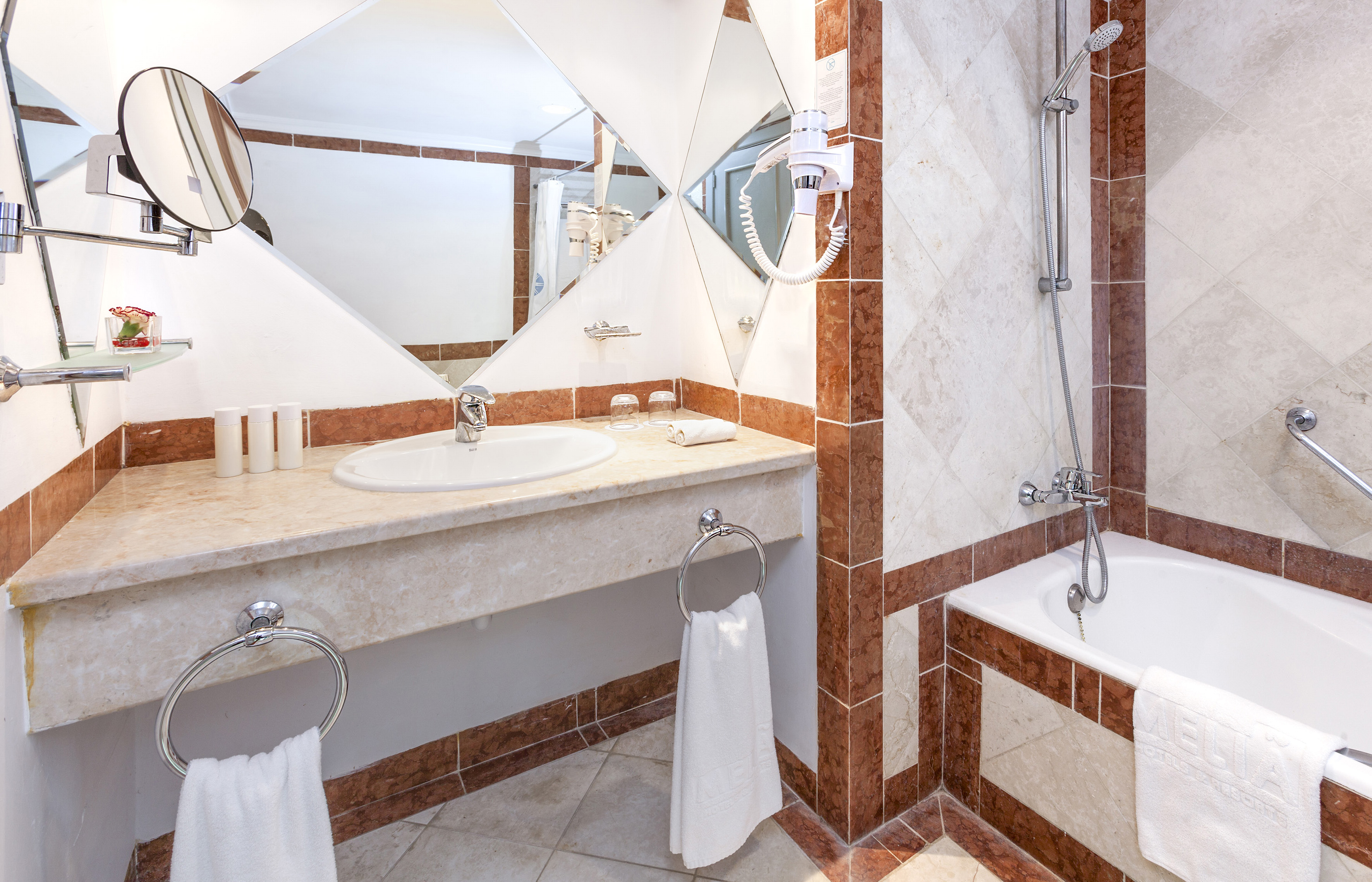 a bathroom with a mirror and sink