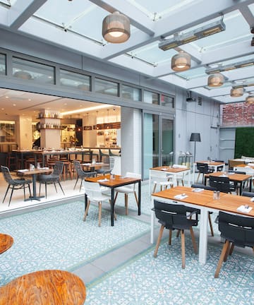 a restaurant with tables and chairs