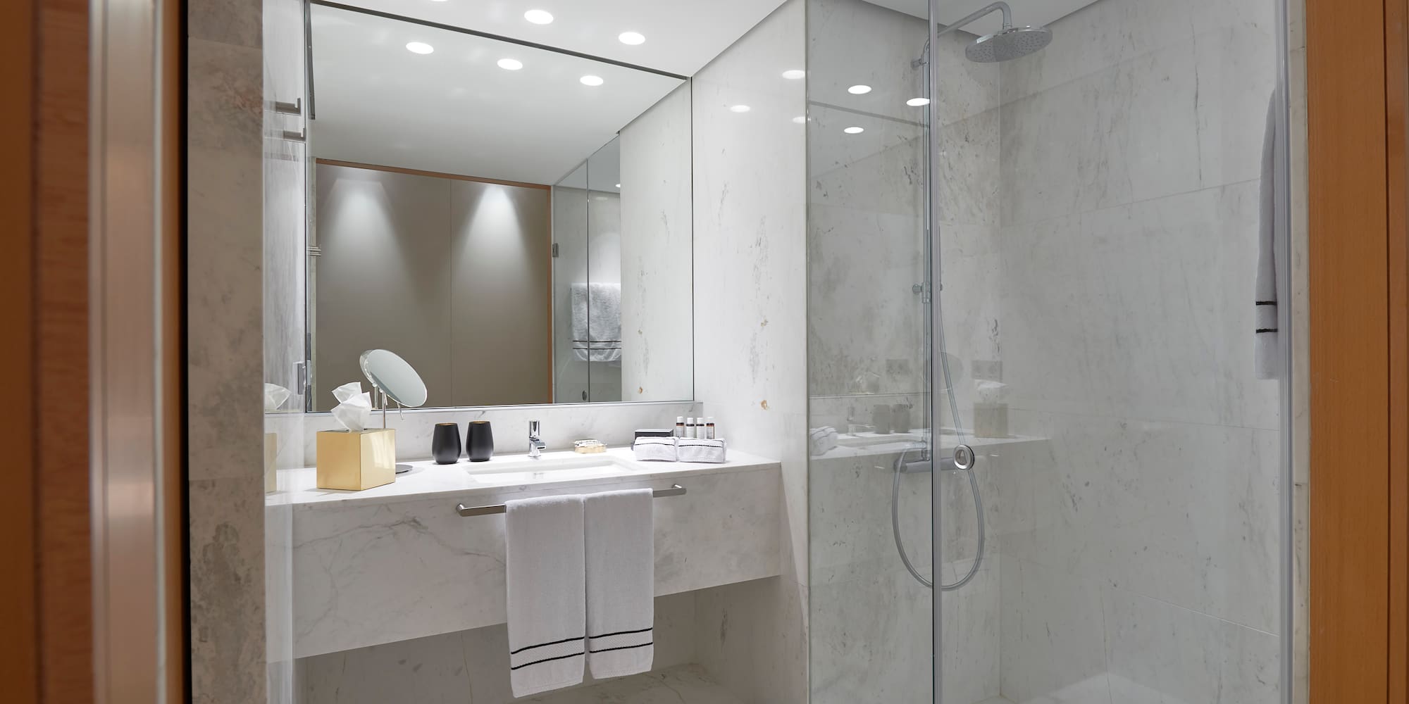 a bathroom with a shower and sink