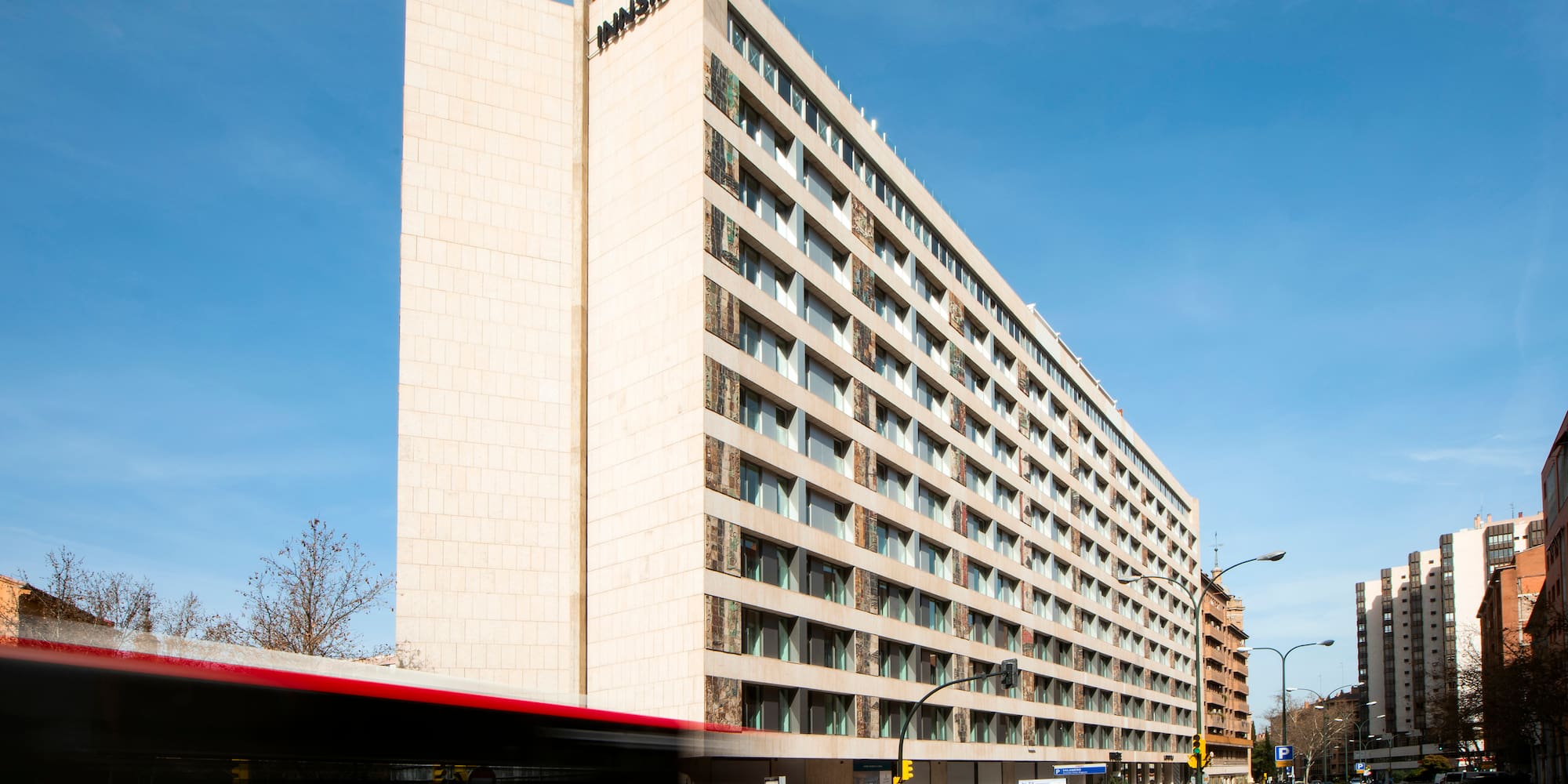 a building with a bus in the background