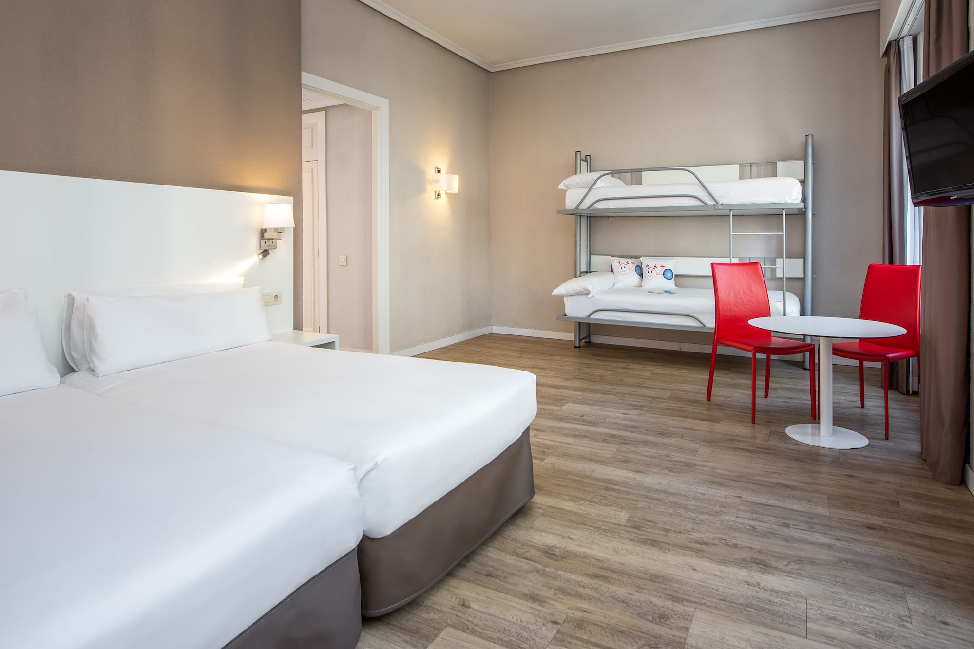 a room with bunk beds and a table