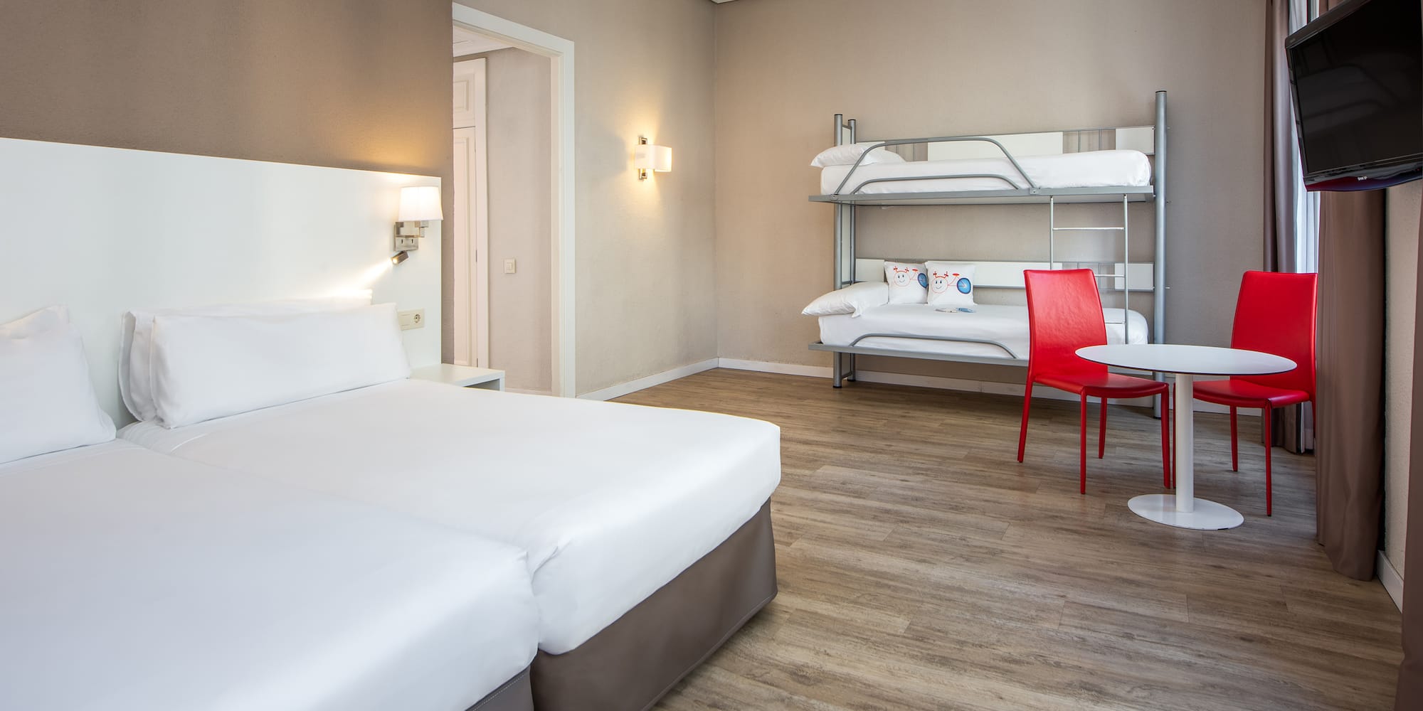 a room with bunk beds and a table