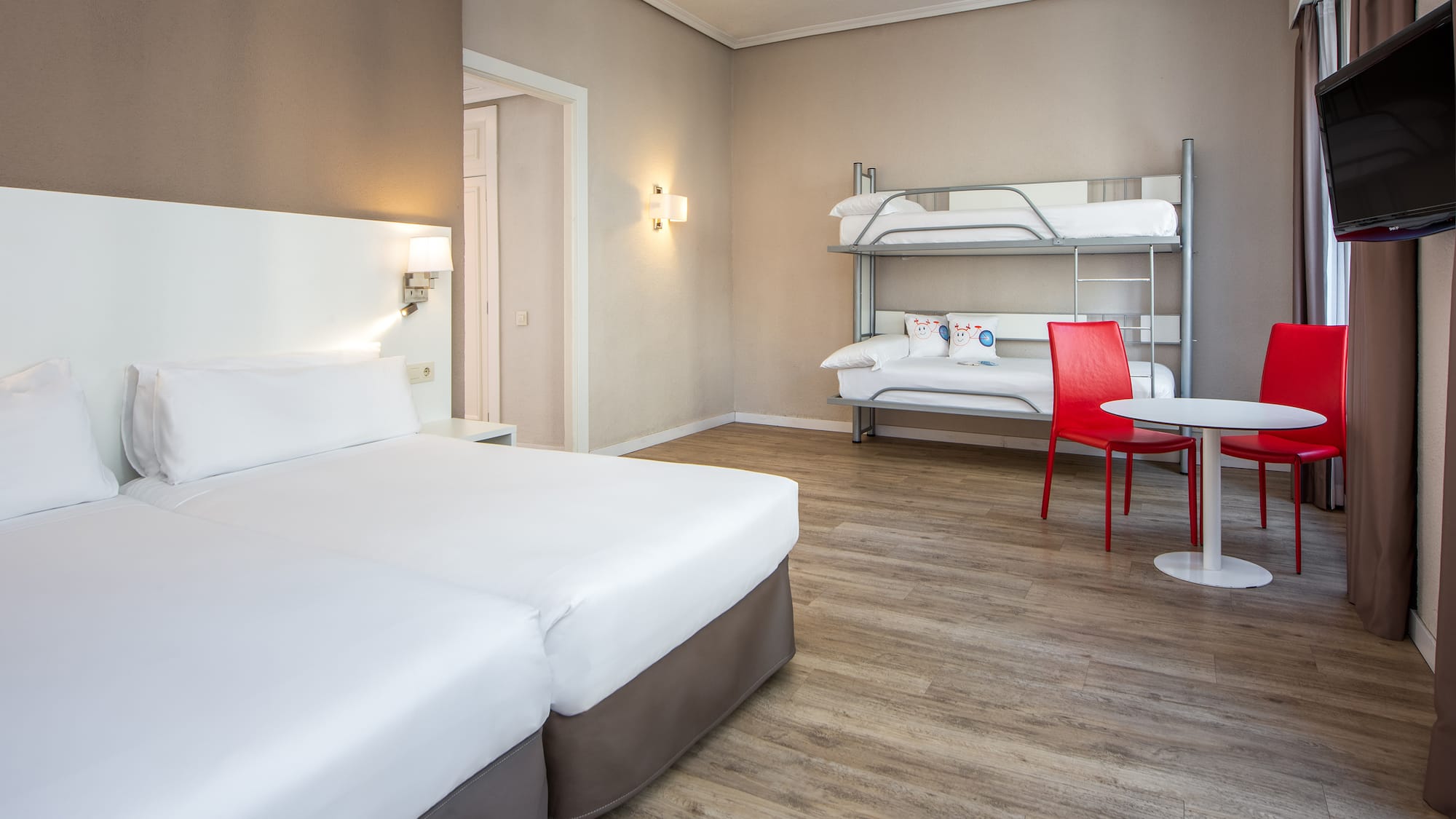 a room with bunk beds and a table