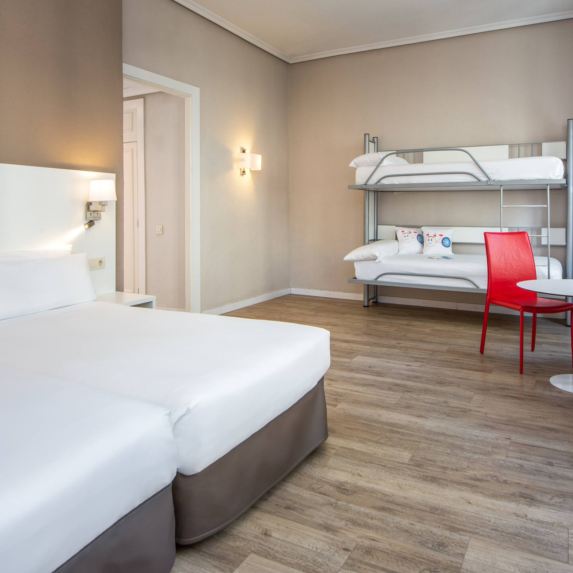 a room with bunk beds and a table