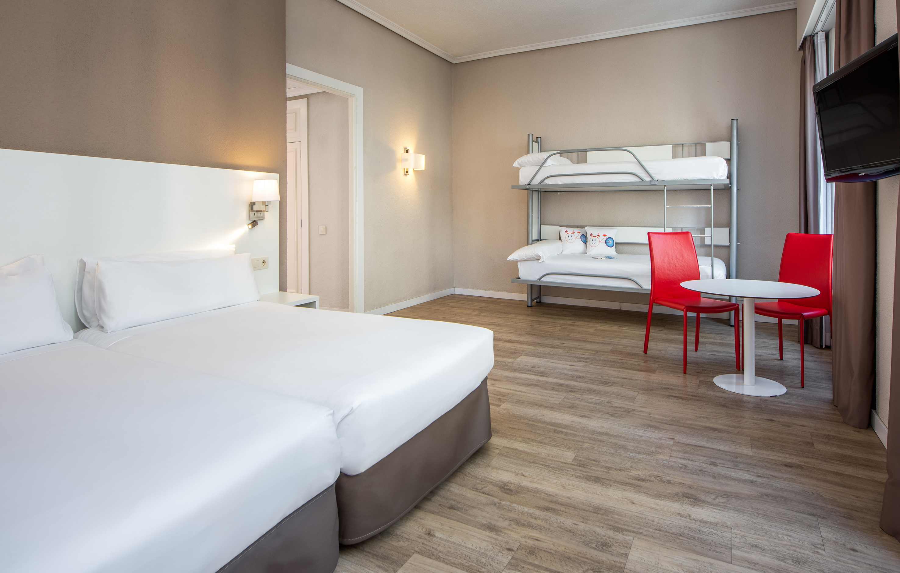 a room with bunk beds and a table