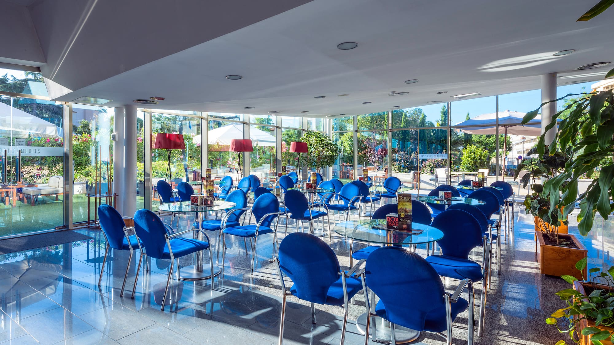a room with blue chairs and tables