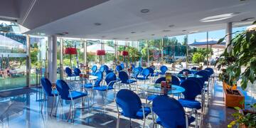 a room with blue chairs and tables