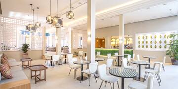 a room with tables and chairs