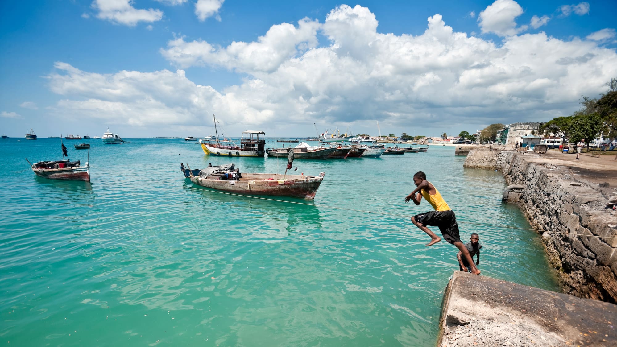 a boy jumping into the water