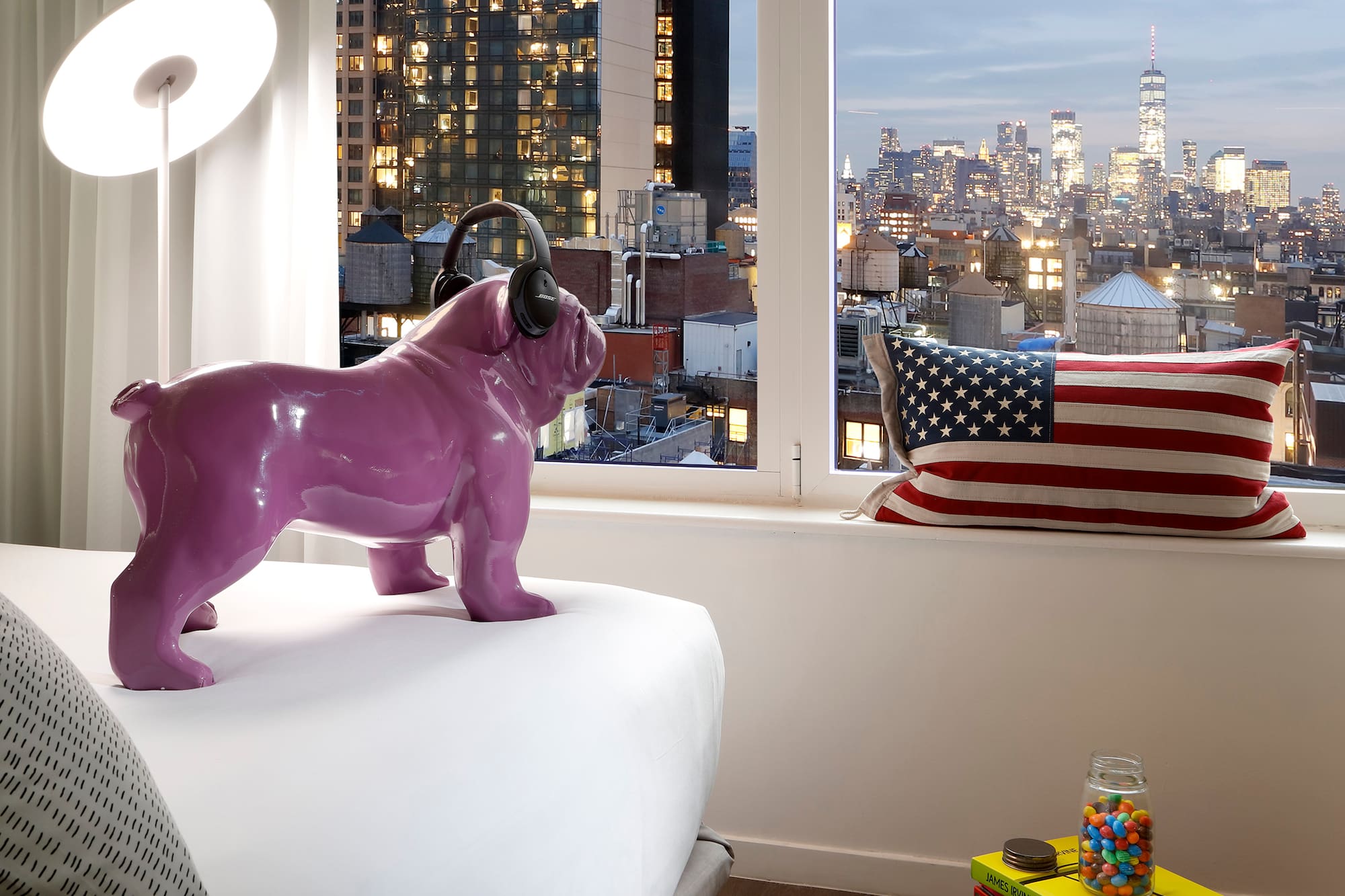 a purple dog statue on a bed