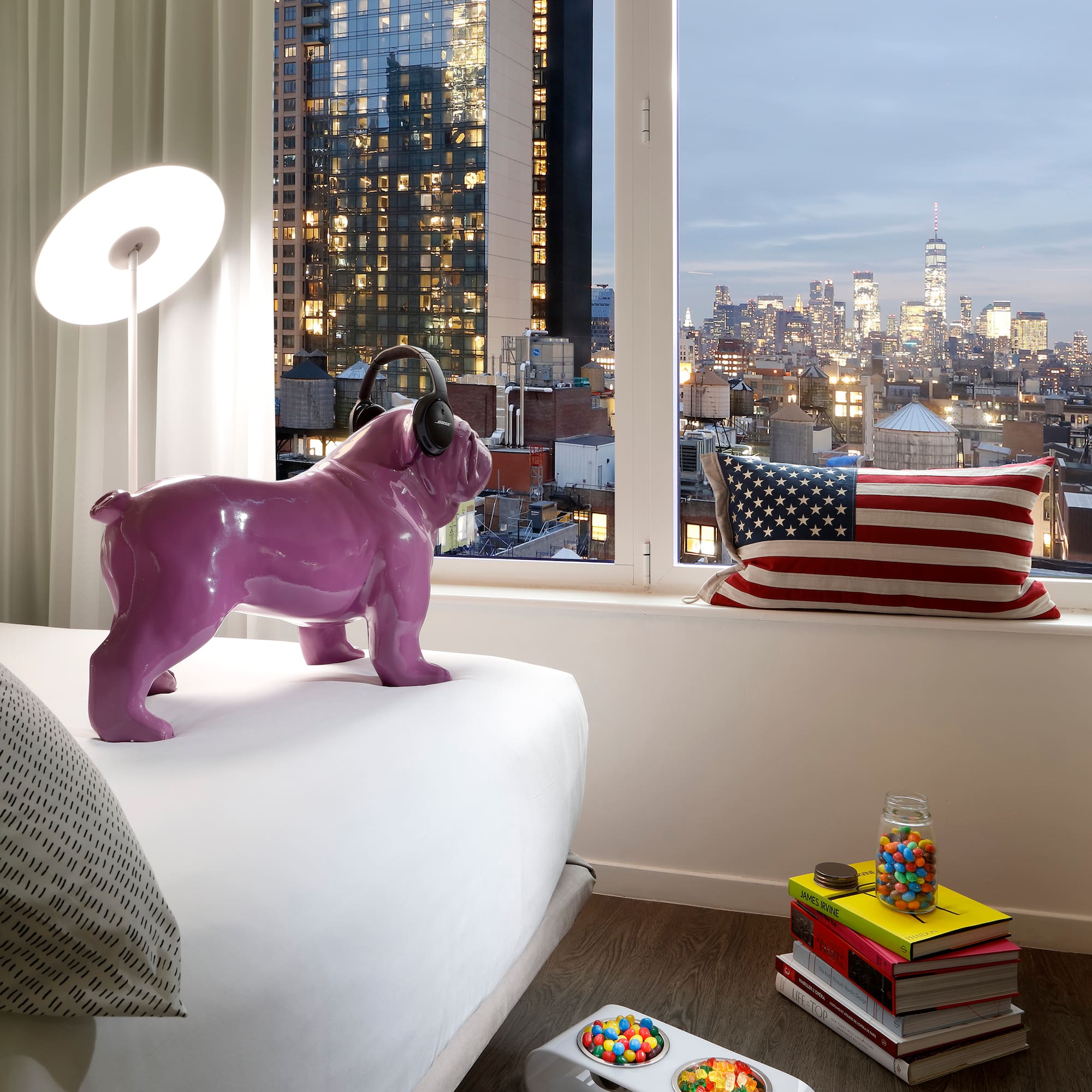 a purple dog statue on a bed