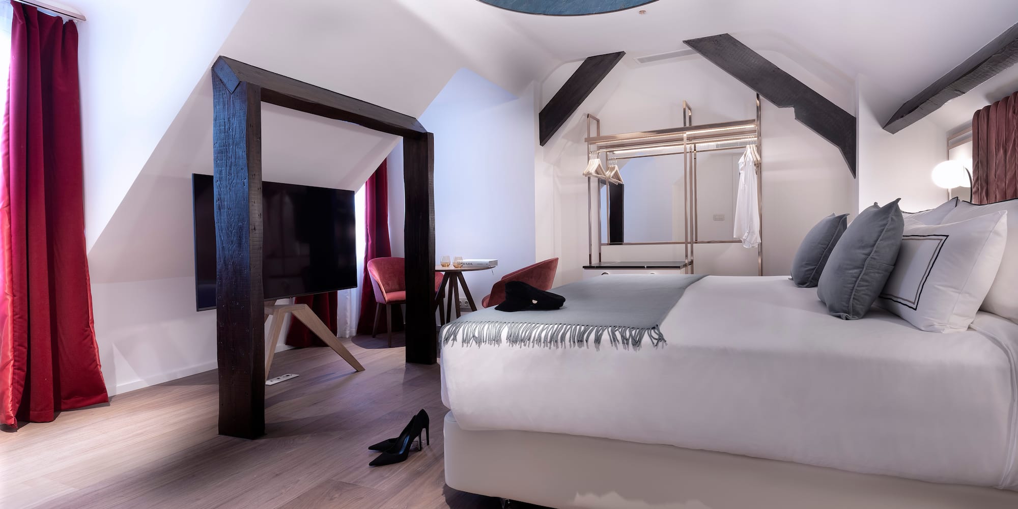 a room with a bed and a tv