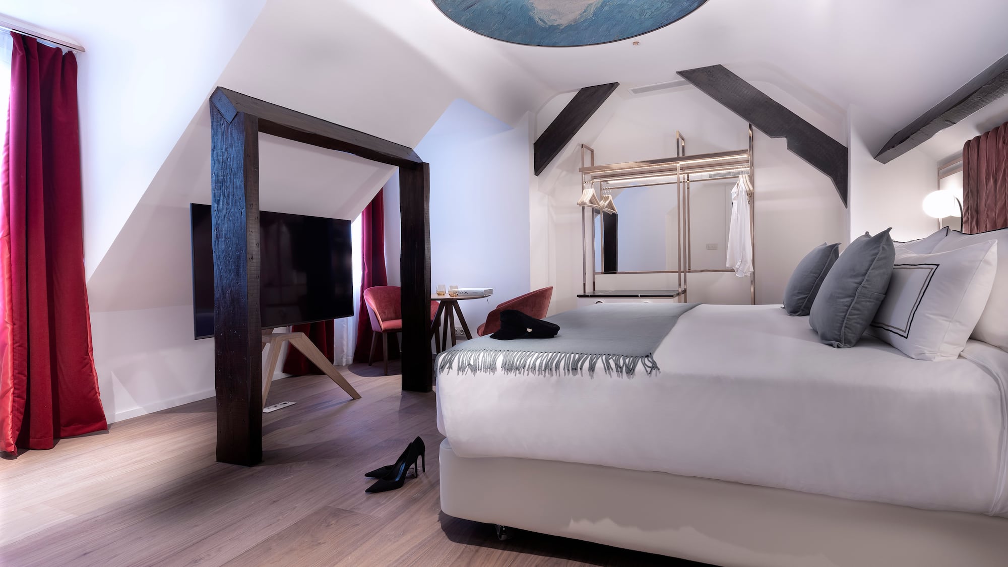 a room with a bed and a tv