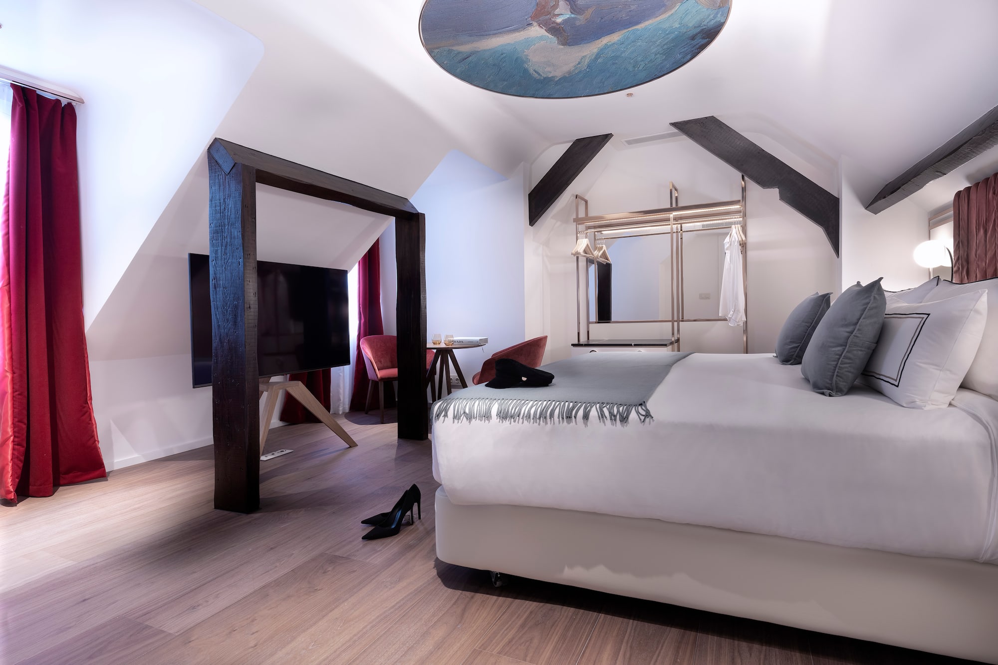 a room with a bed and a tv