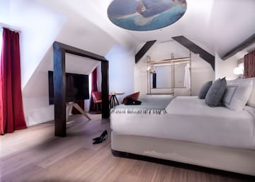 a room with a bed and a tv