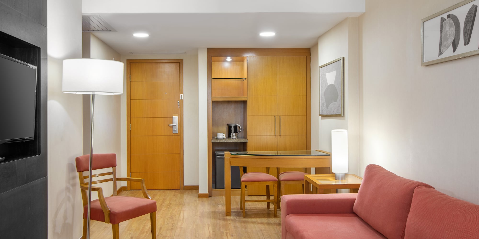 a living room with a table and chairs
