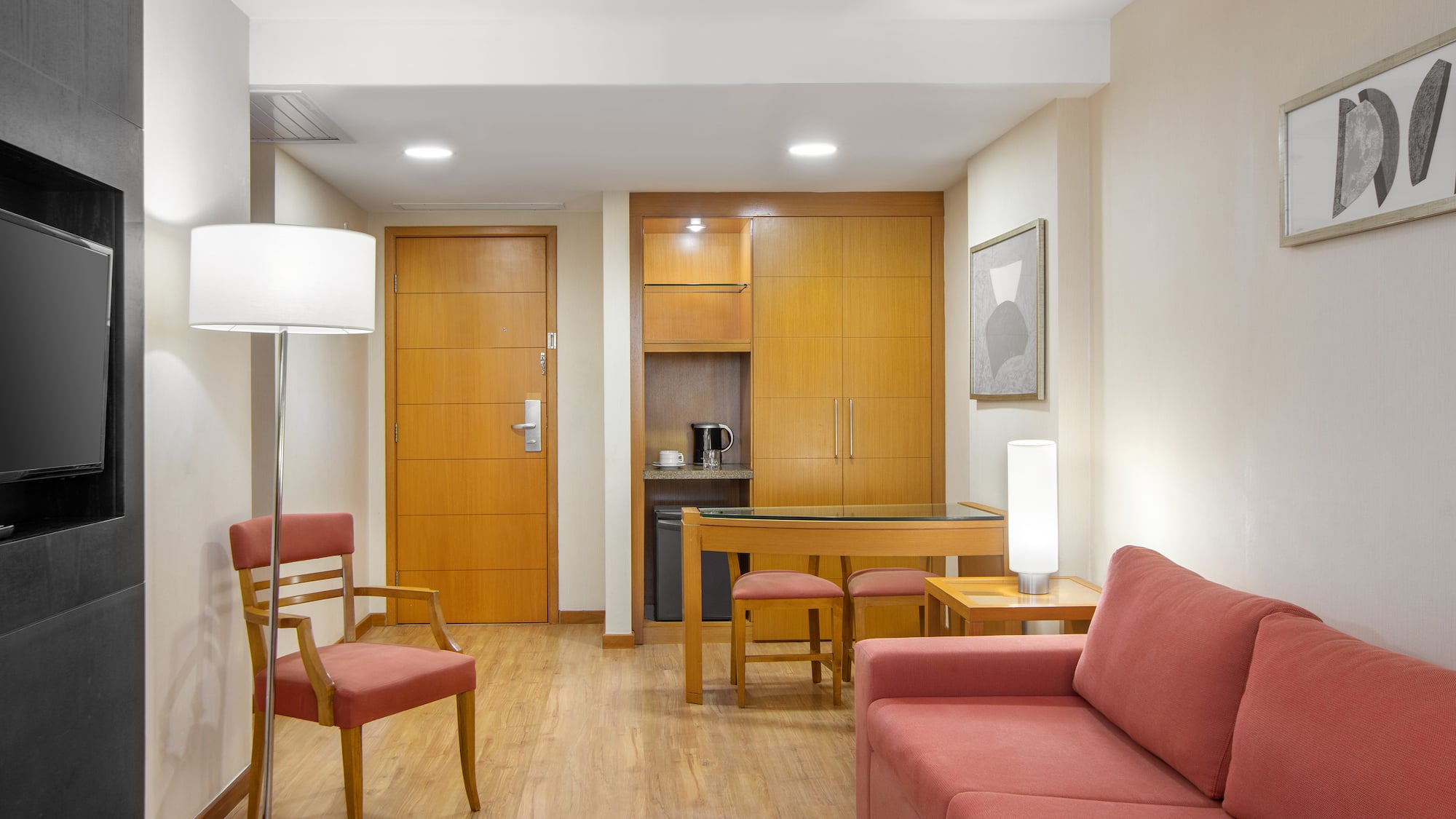 a living room with a table and chairs