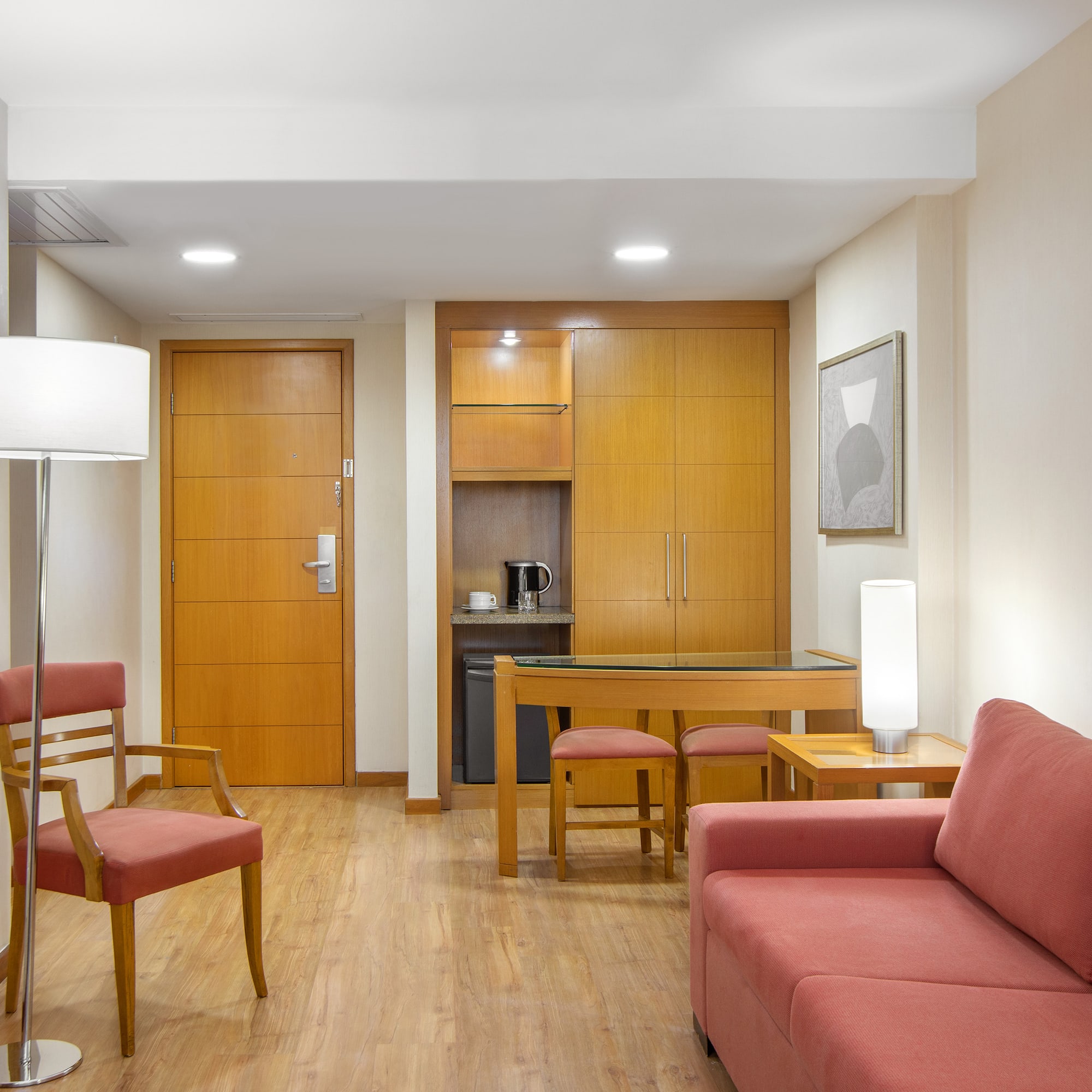 a living room with a table and chairs