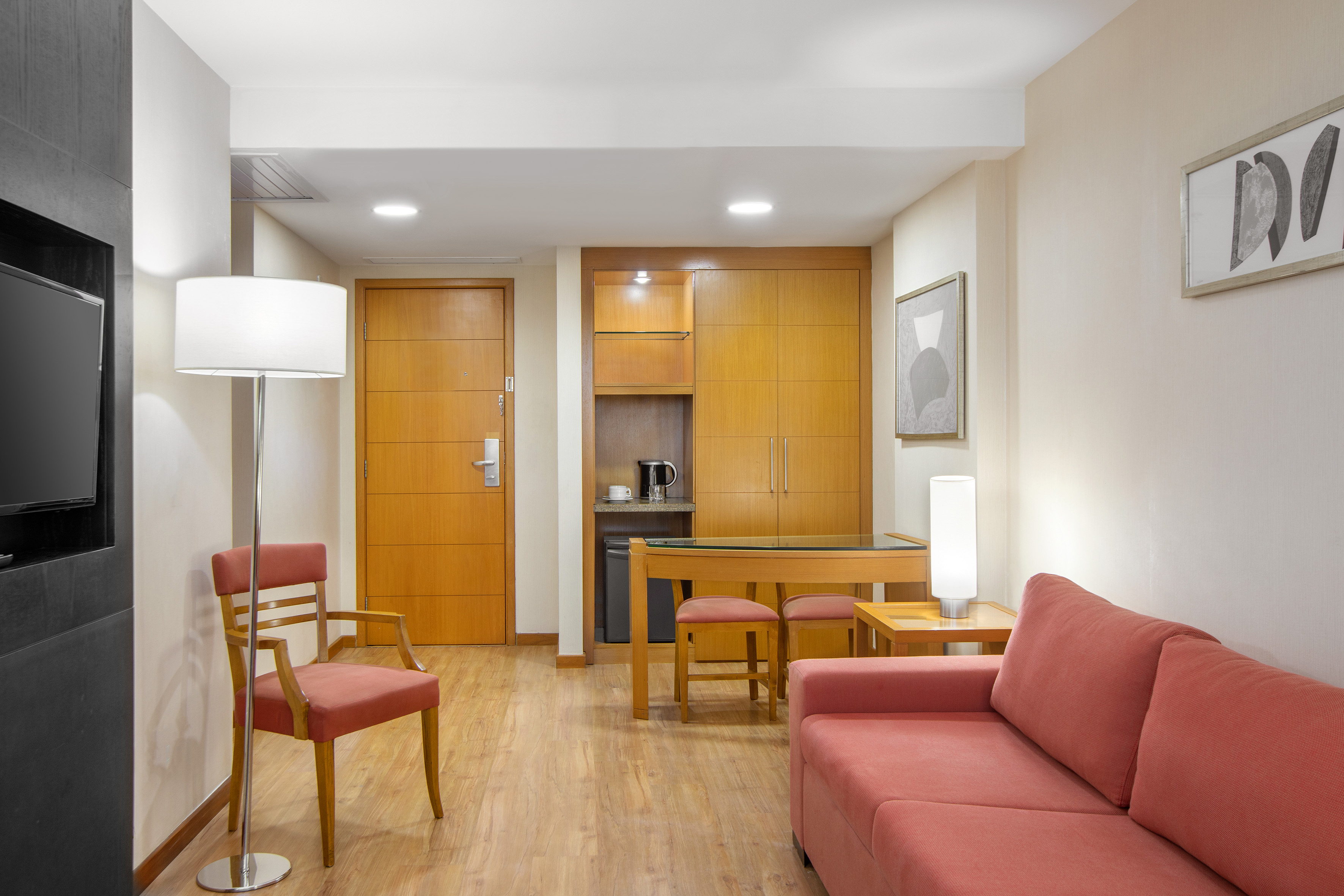 a living room with a table and chairs