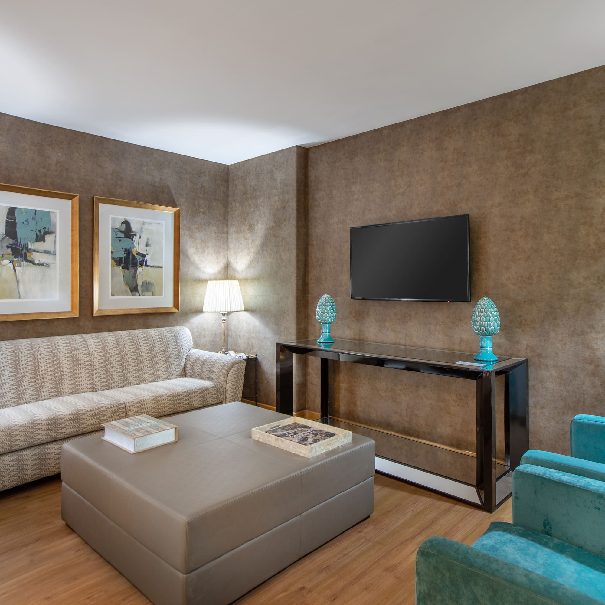 a living room with a tv and couch