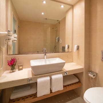 a bathroom with a sink toilet and toilet
