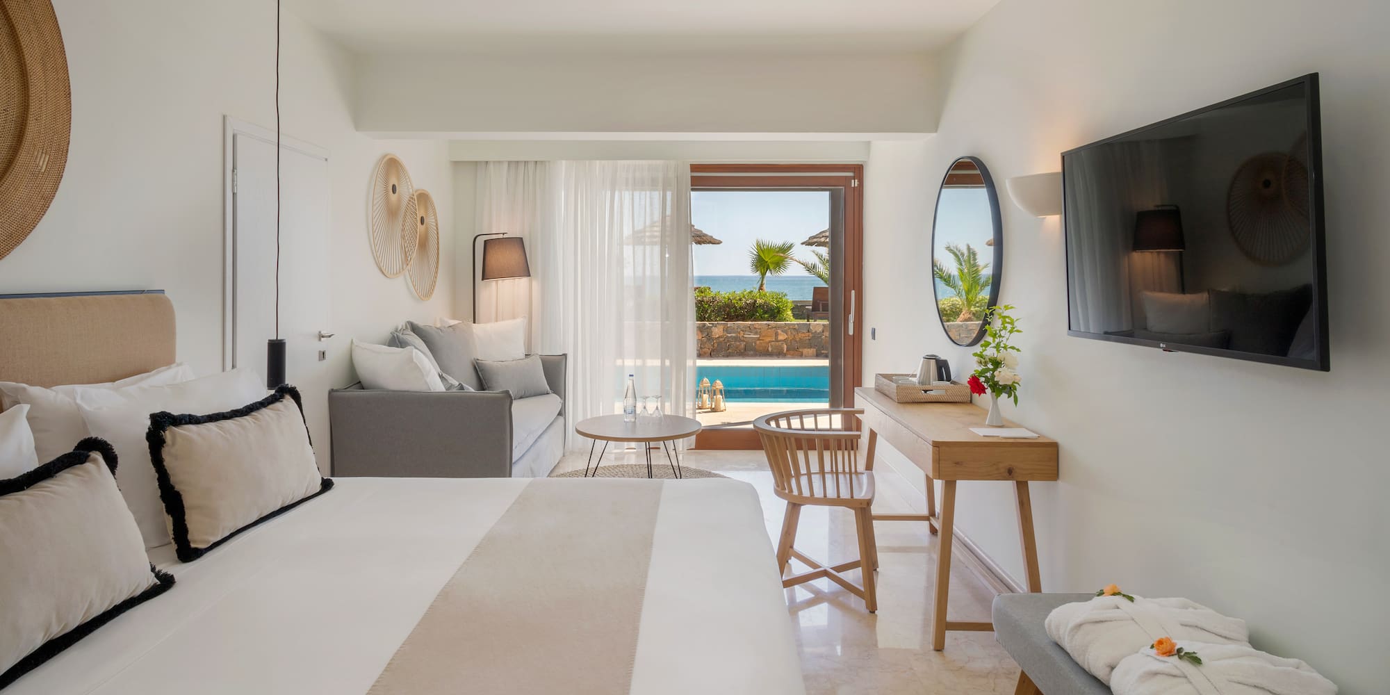 a room with a bed and a television