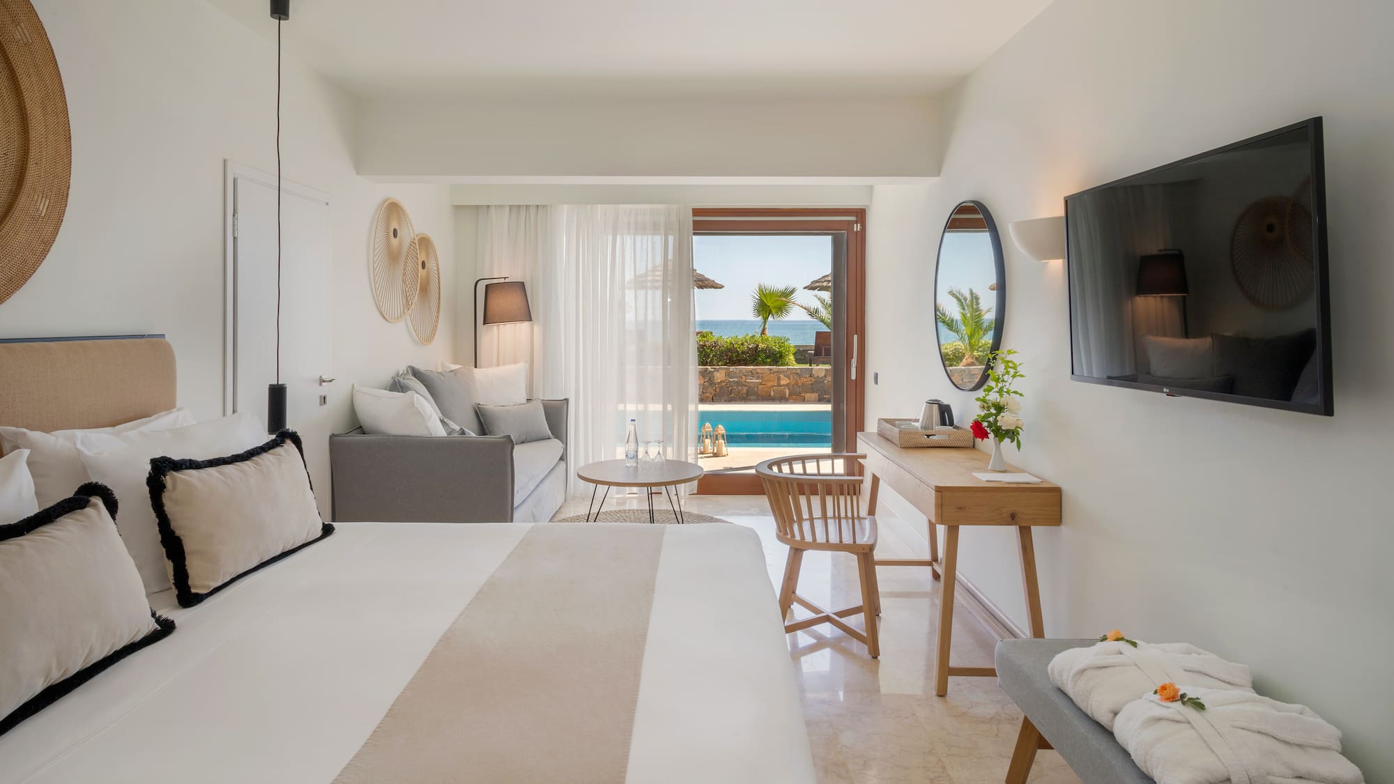 a room with a bed and a television