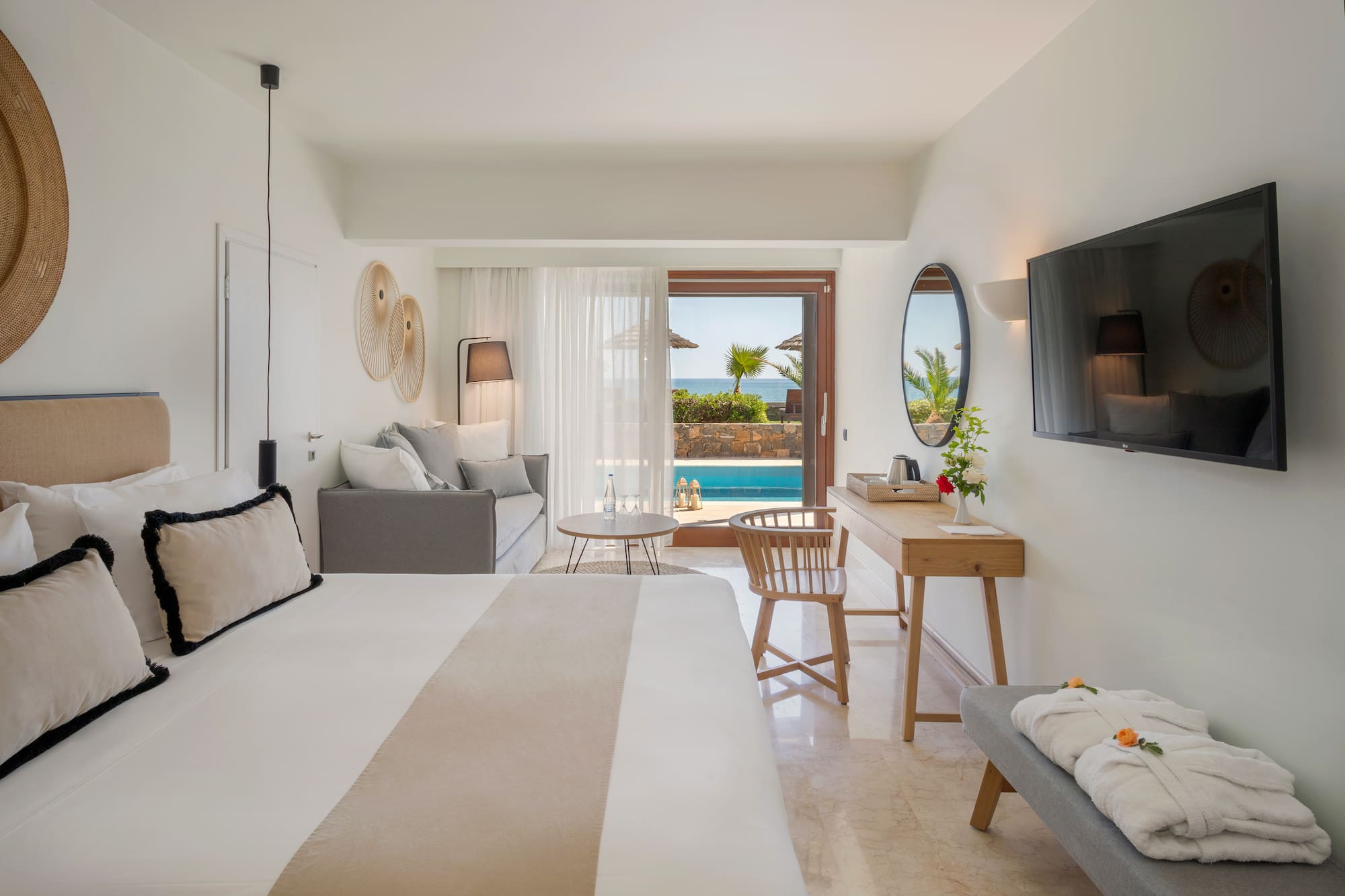 a room with a bed and a television