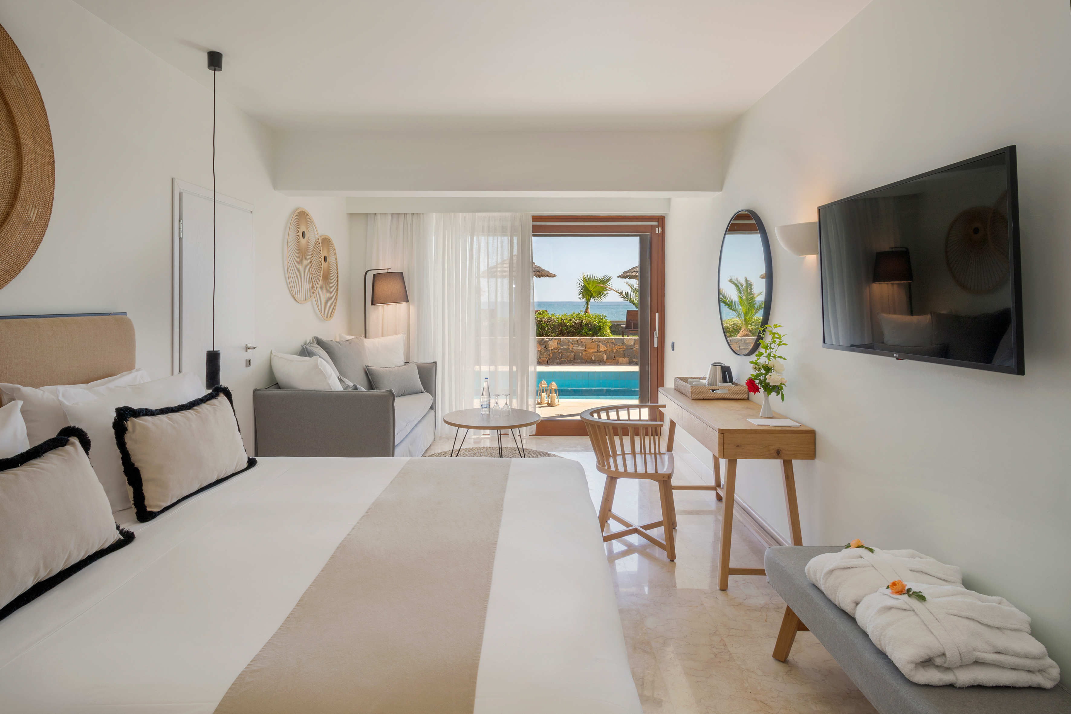 a room with a bed and a television