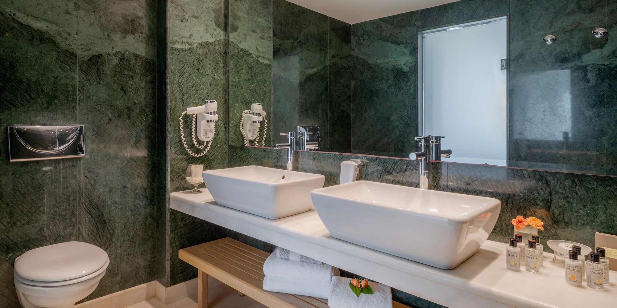 a bathroom with sinks and a mirror