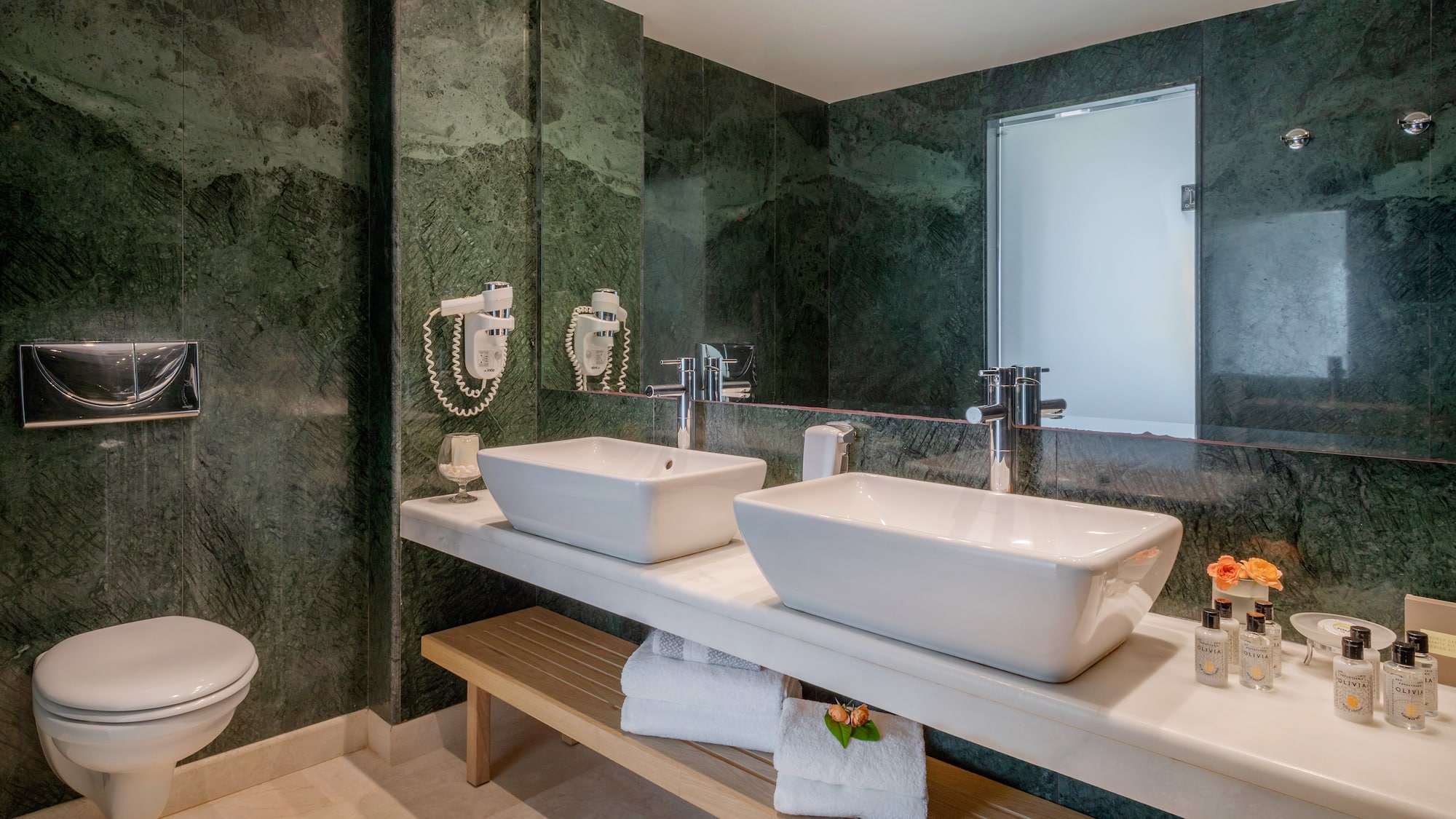 a bathroom with sinks and a mirror