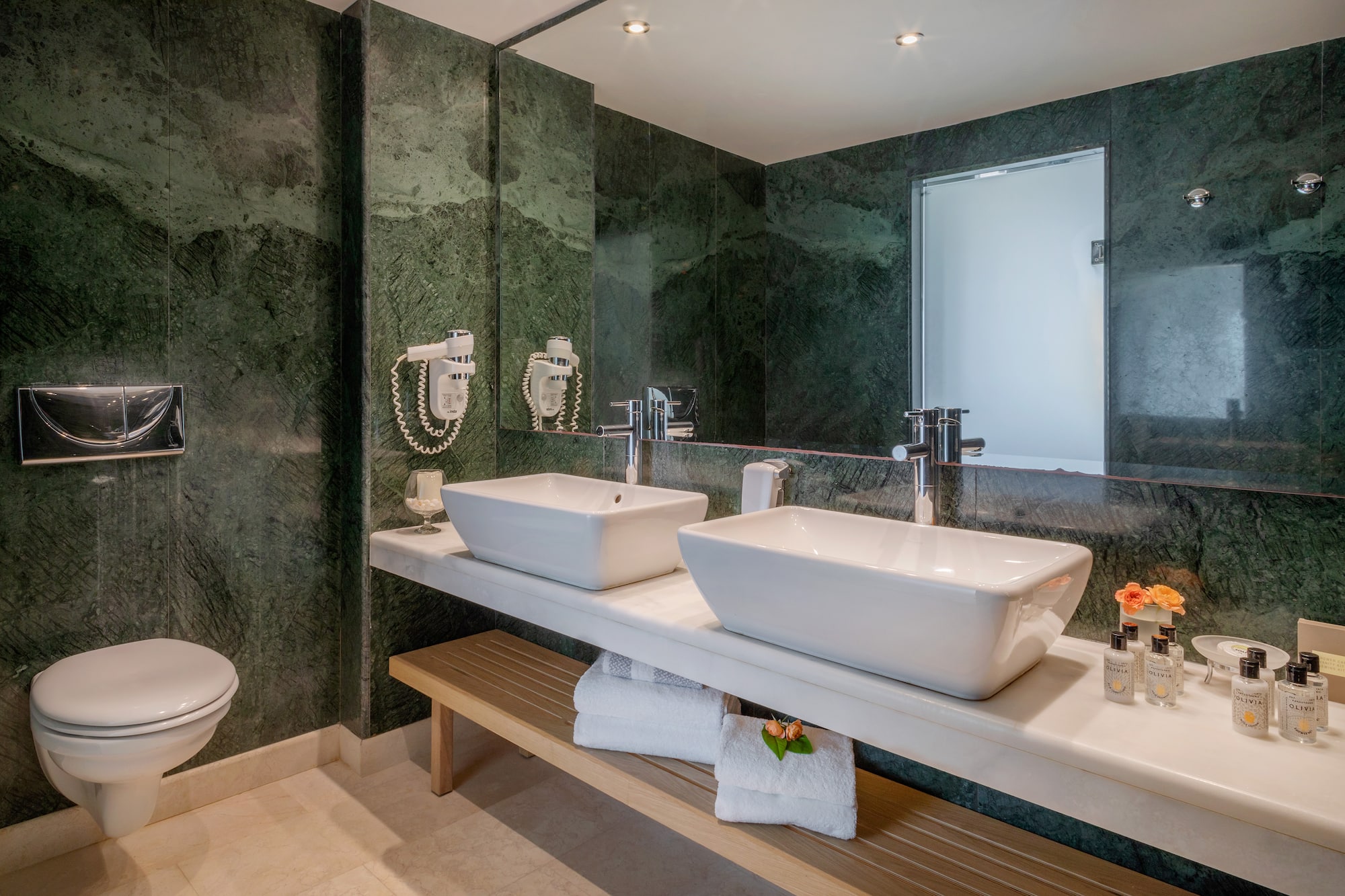 a bathroom with sinks and a mirror