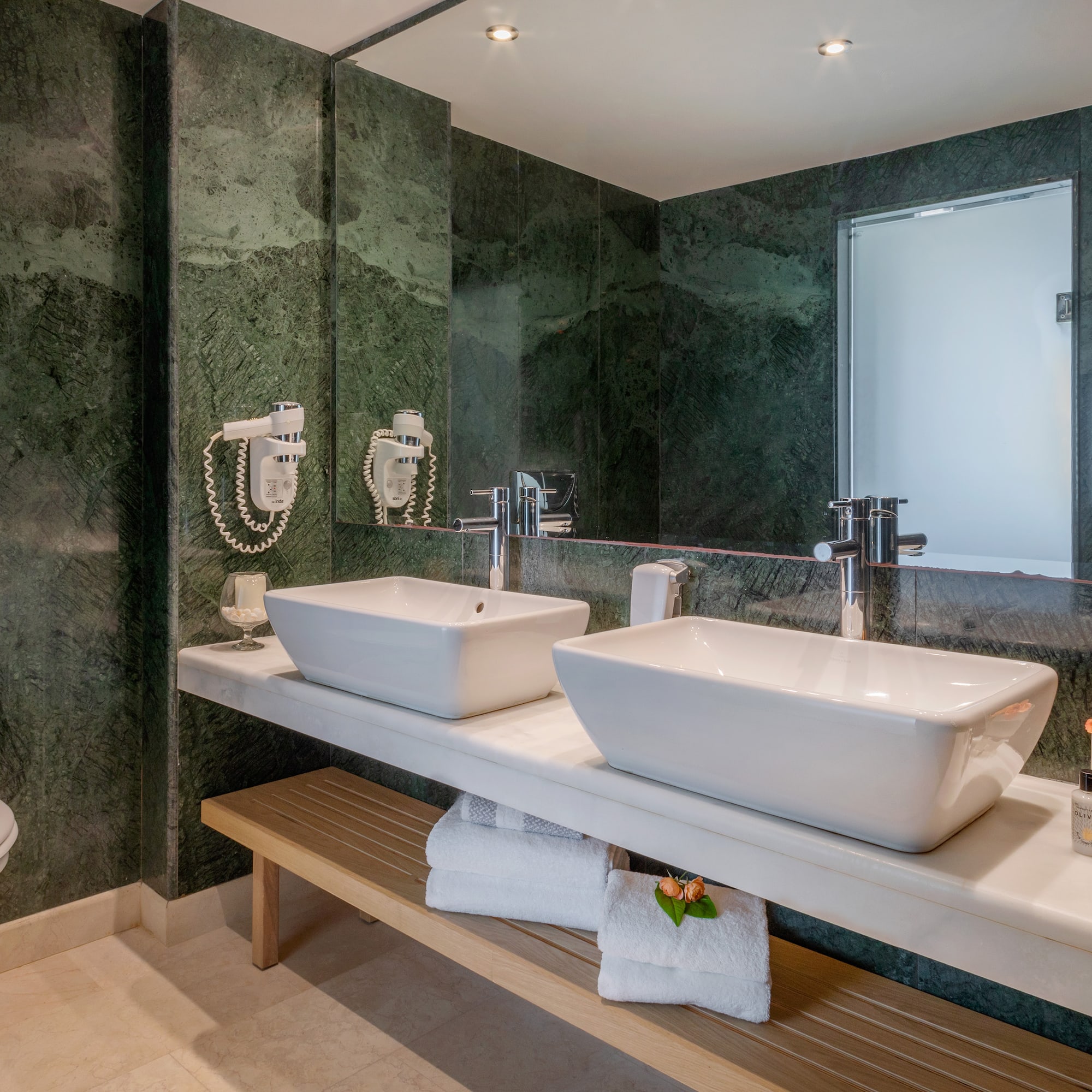 a bathroom with sinks and a mirror