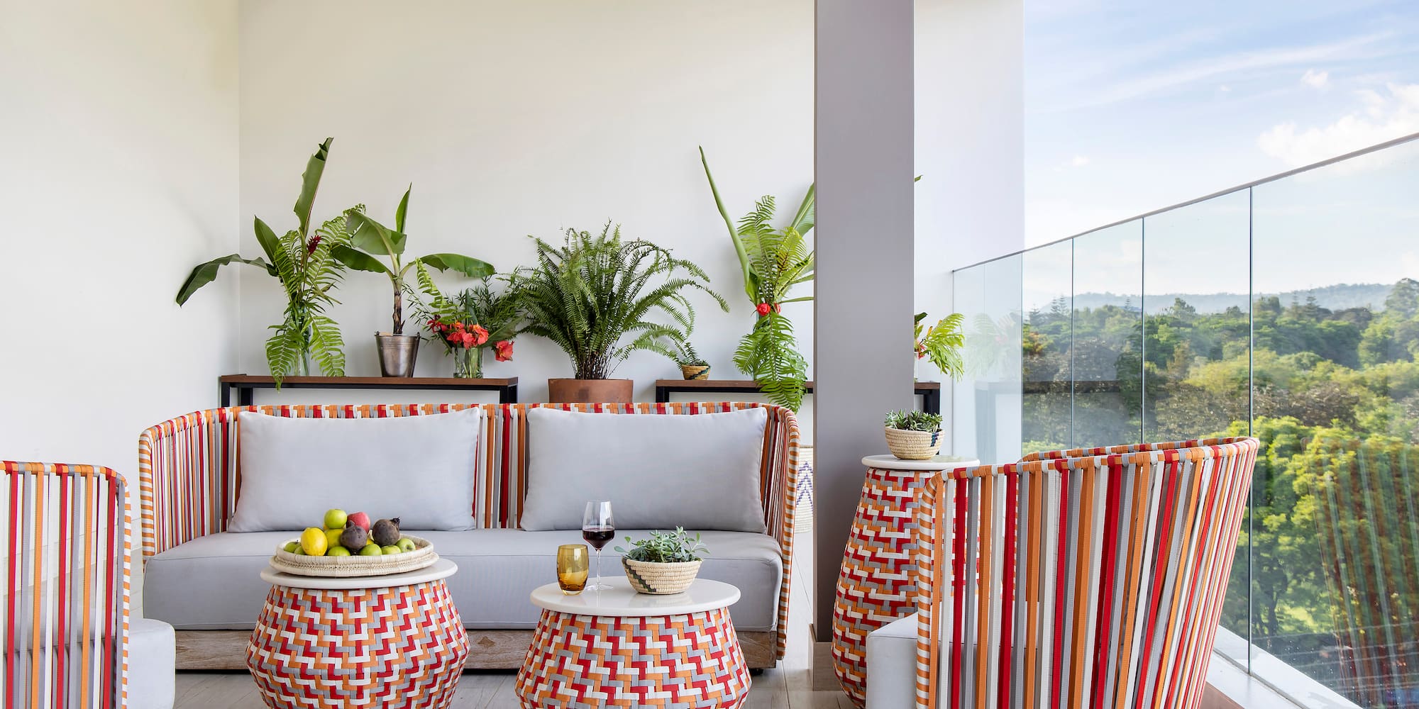 a patio with a couch and chairs