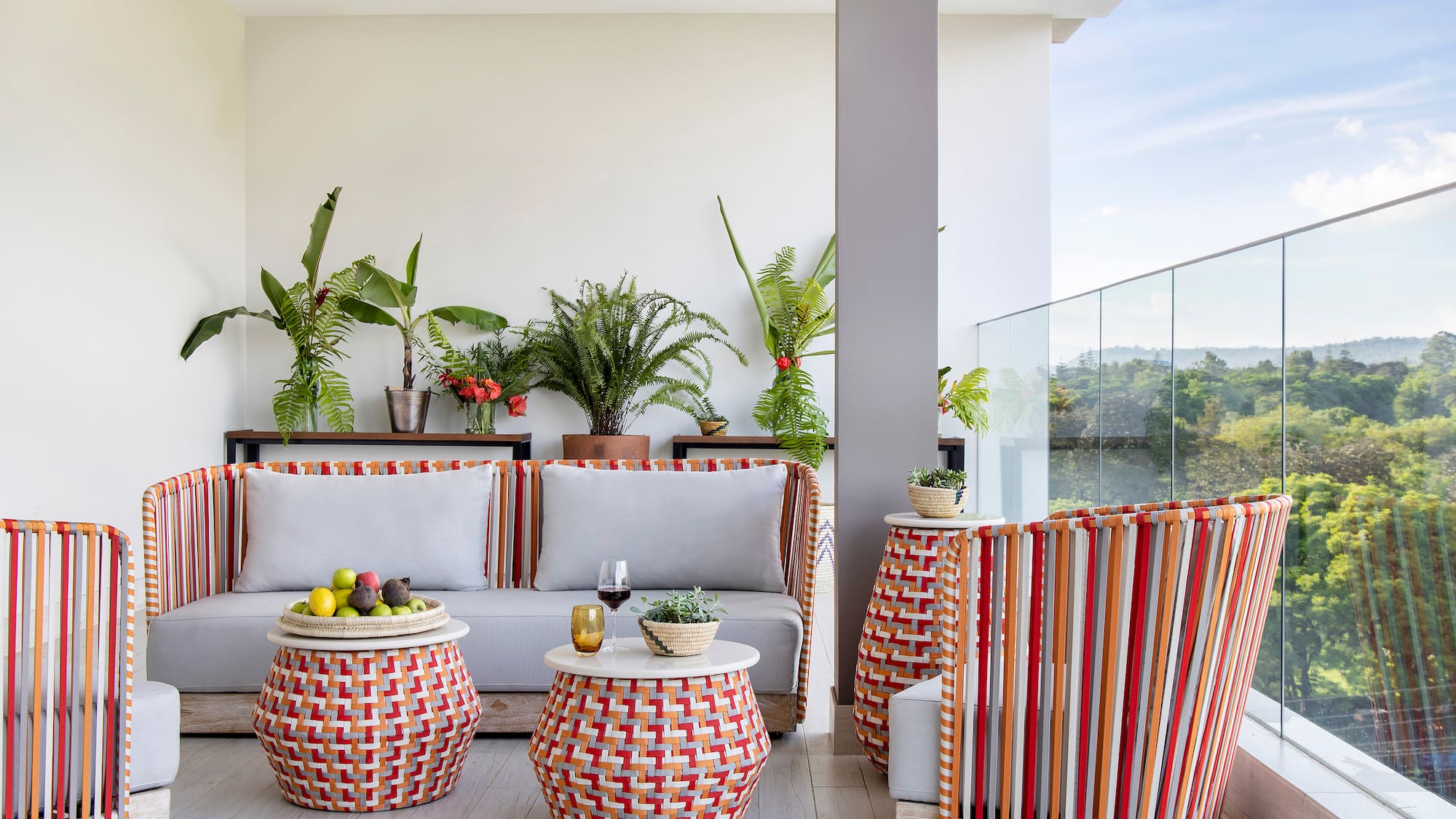 a patio with a couch and chairs