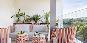 a patio with a couch and chairs